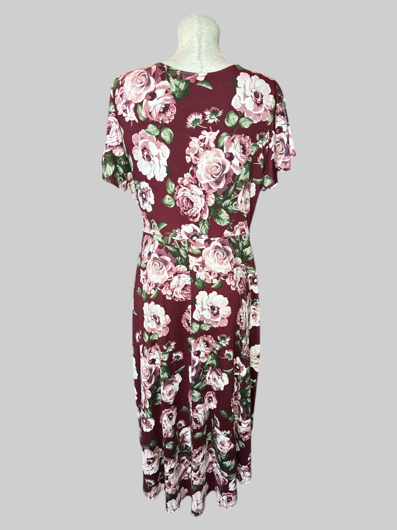 1X Maroon floral faux wrap dress with tie on front, flowy sleeves, and high low hem