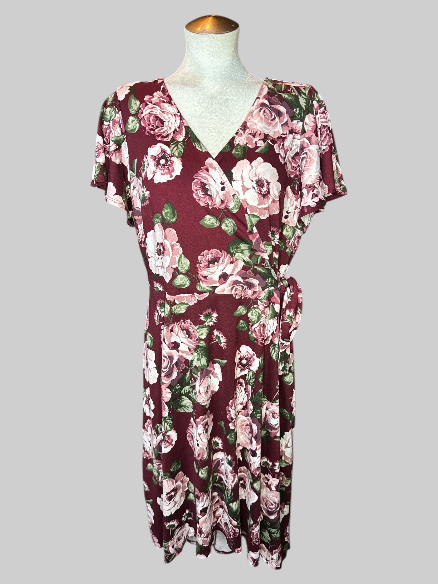 1X Maroon floral faux wrap dress with tie on front, flowy sleeves, and high low hem
