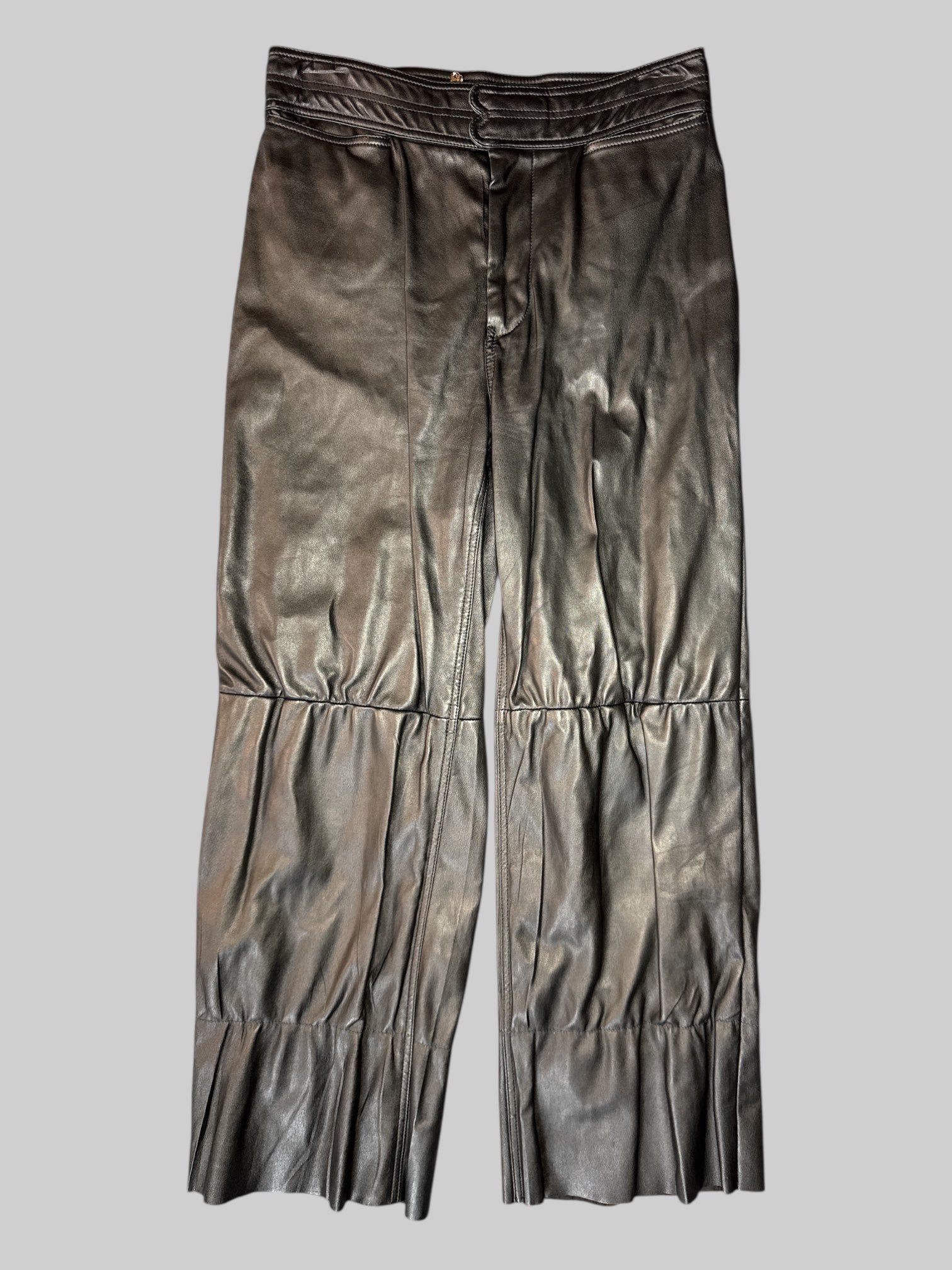 M A Piece Apart black leather pants with pockets, panel design, and cut bottom hems