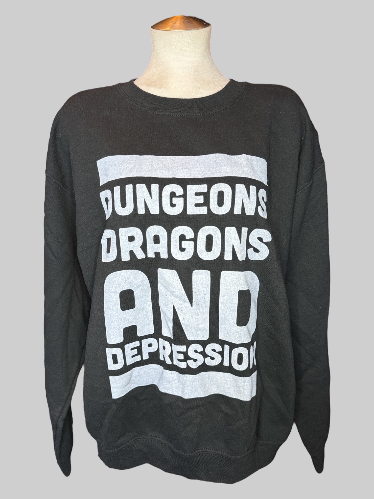 1X Black sweatshirt with dungeons dragons and depression” graphic