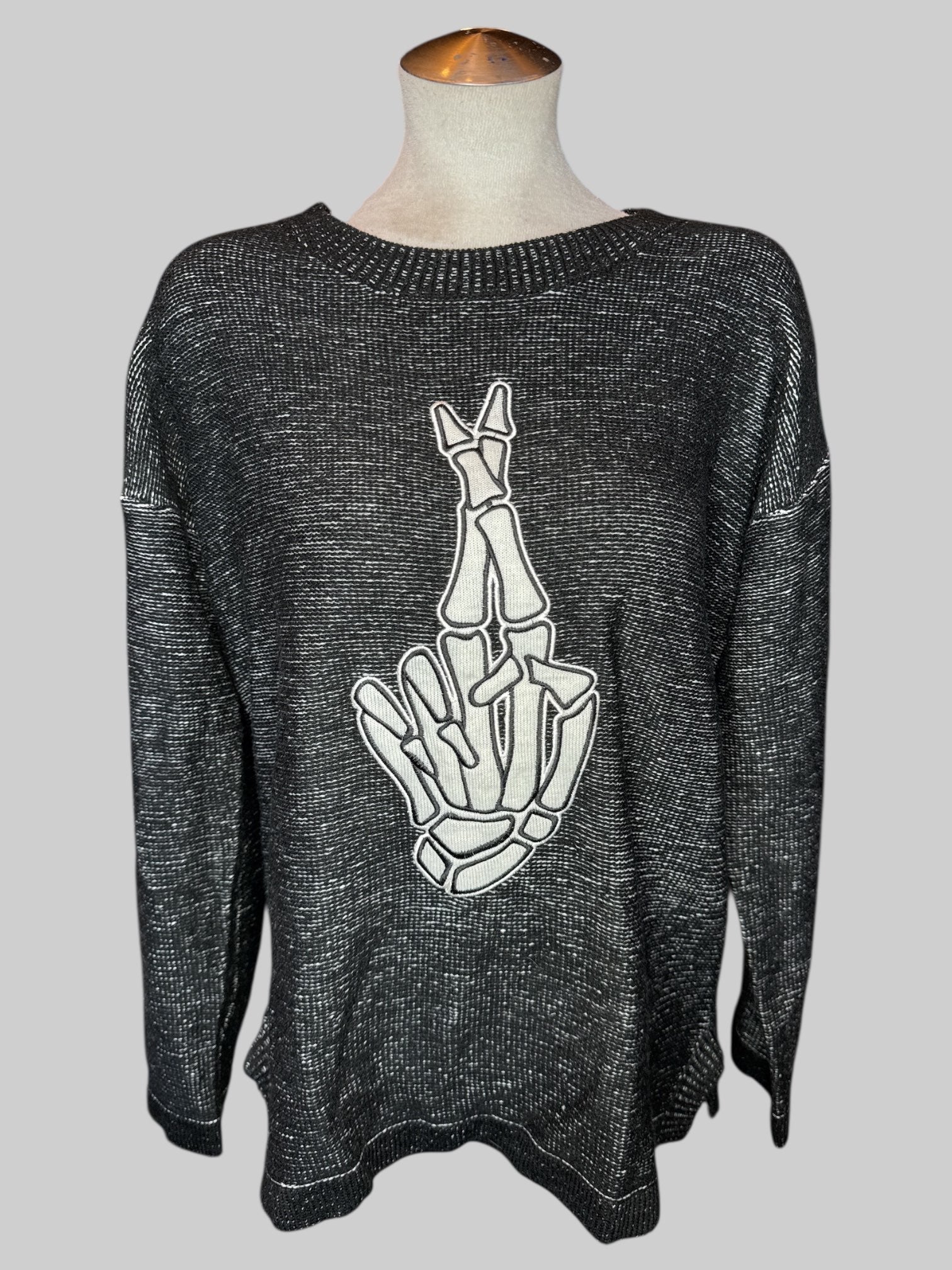 1X Black and white sweater with skeleton hand crossing fingers embroidery