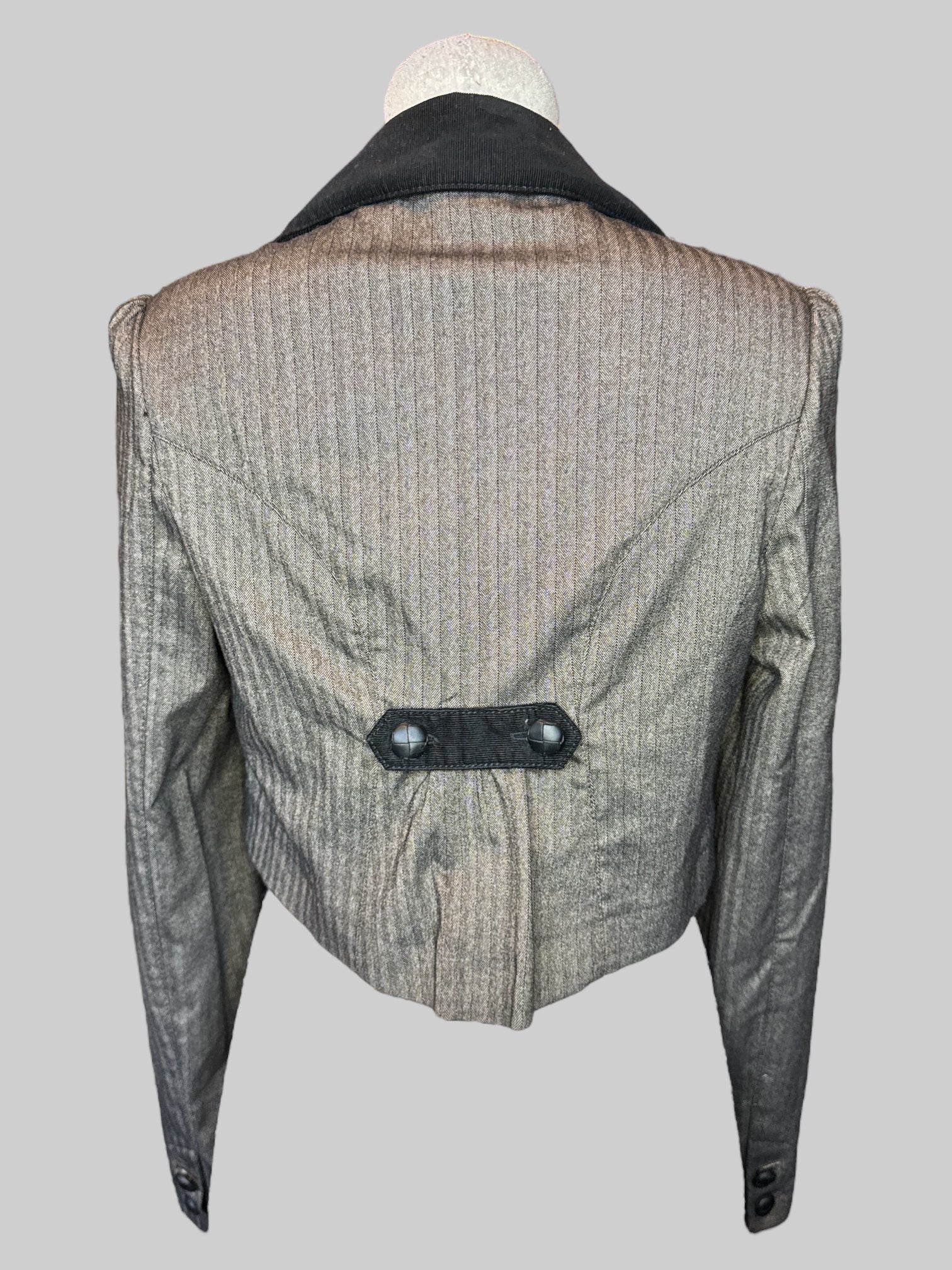 M Brownish long sleeve laser with black ripped taller front pocket and poof shoulders