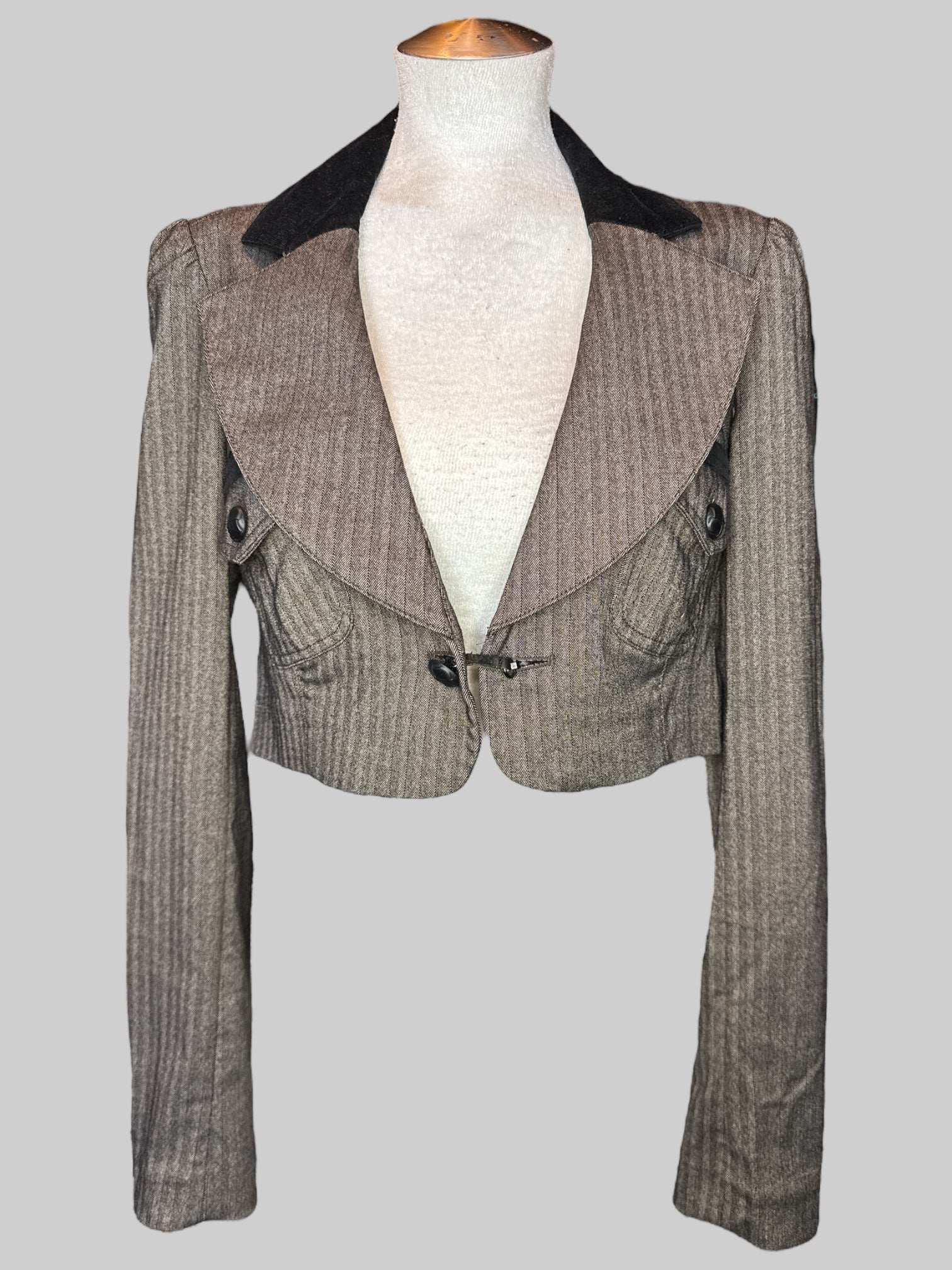 M Brownish long sleeve laser with black ripped taller front pocket and poof shoulders
