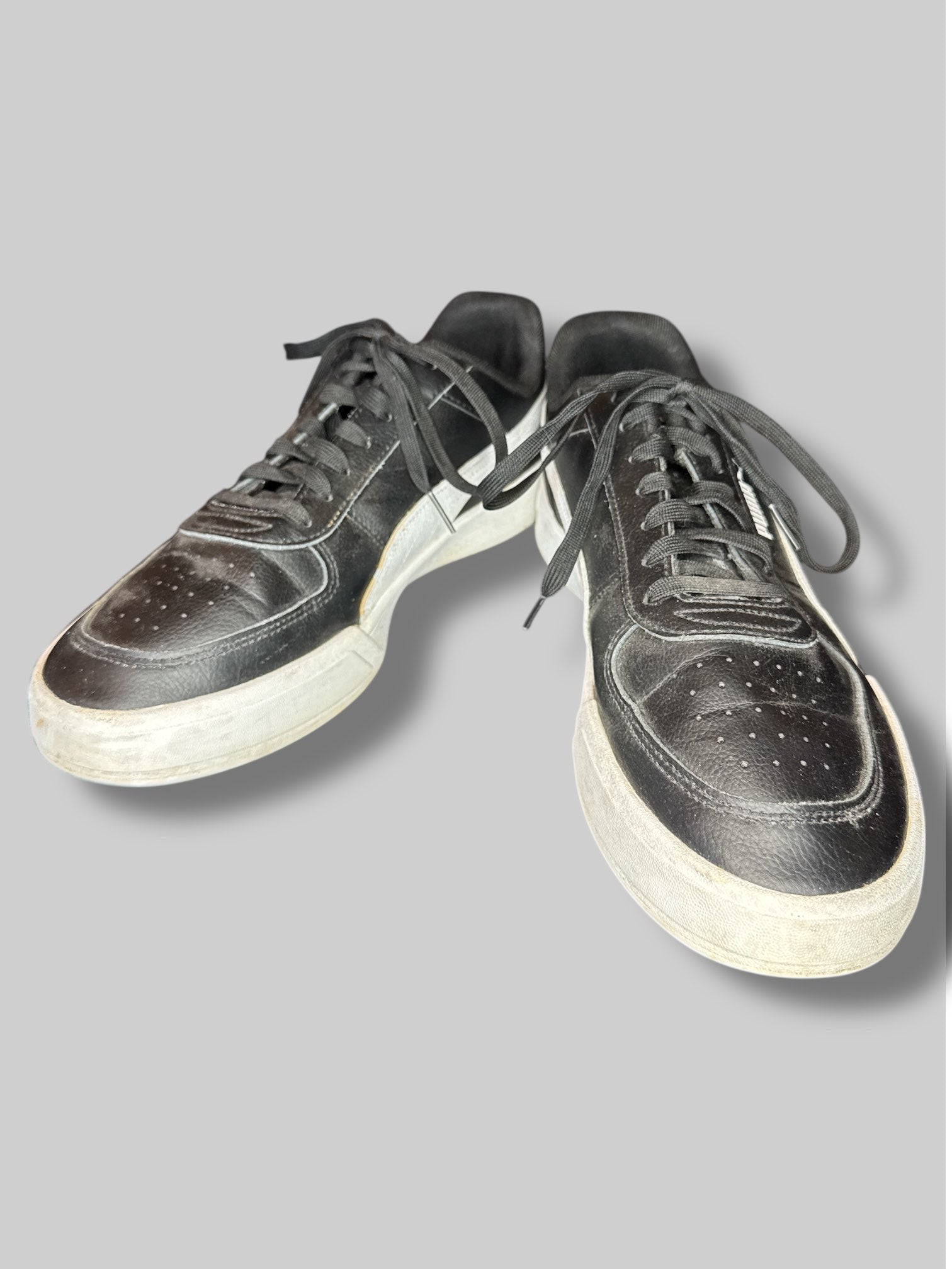 Size US 13 men’s Puma black and white sneakers