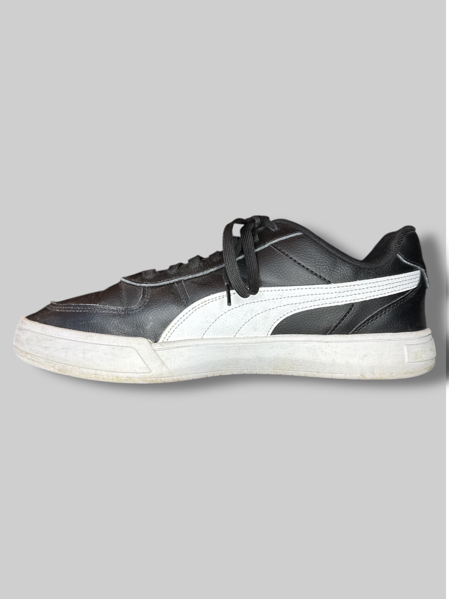 Size US 13 men’s Puma black and white sneakers