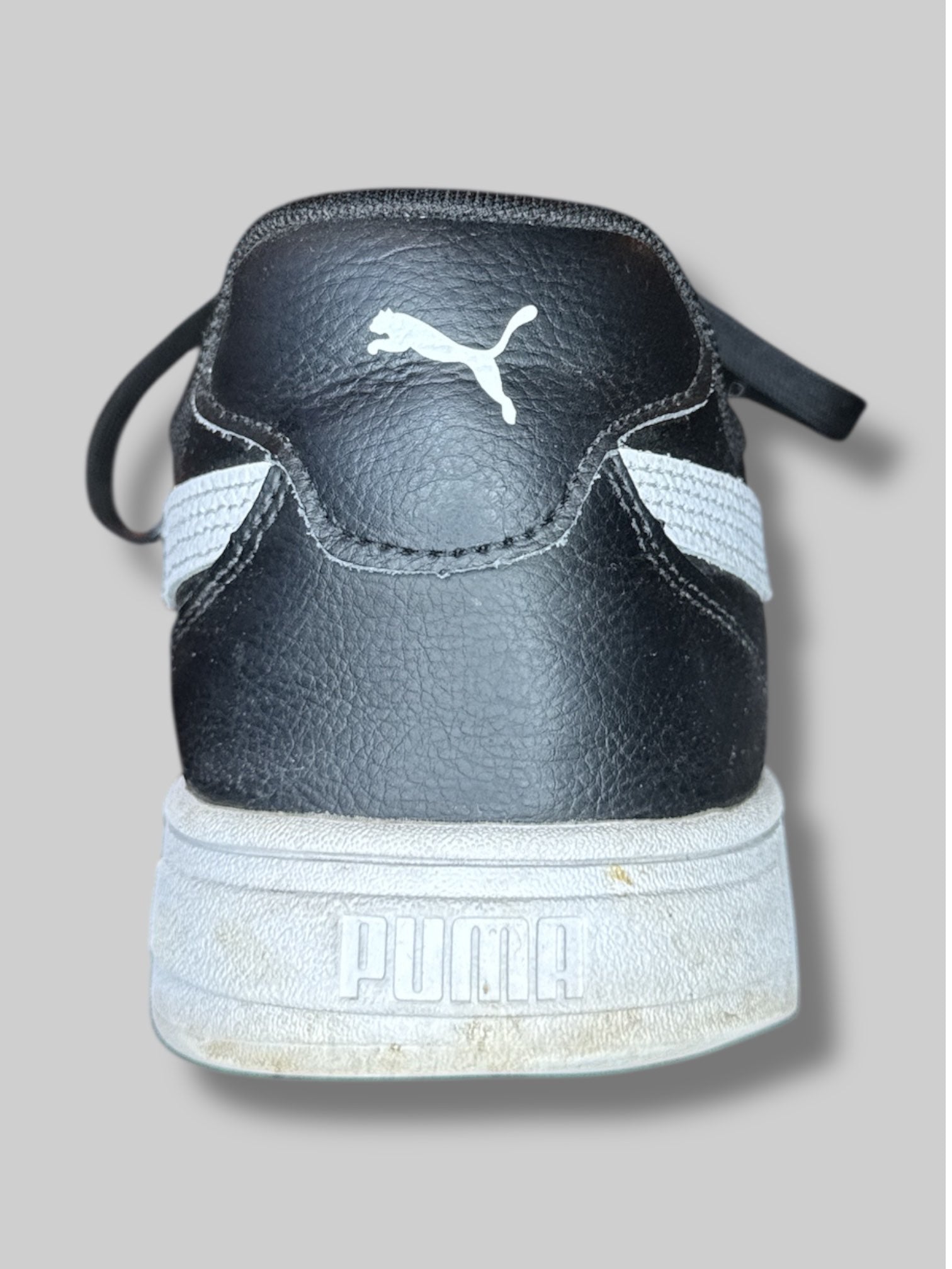 Size US 13 men’s Puma black and white sneakers