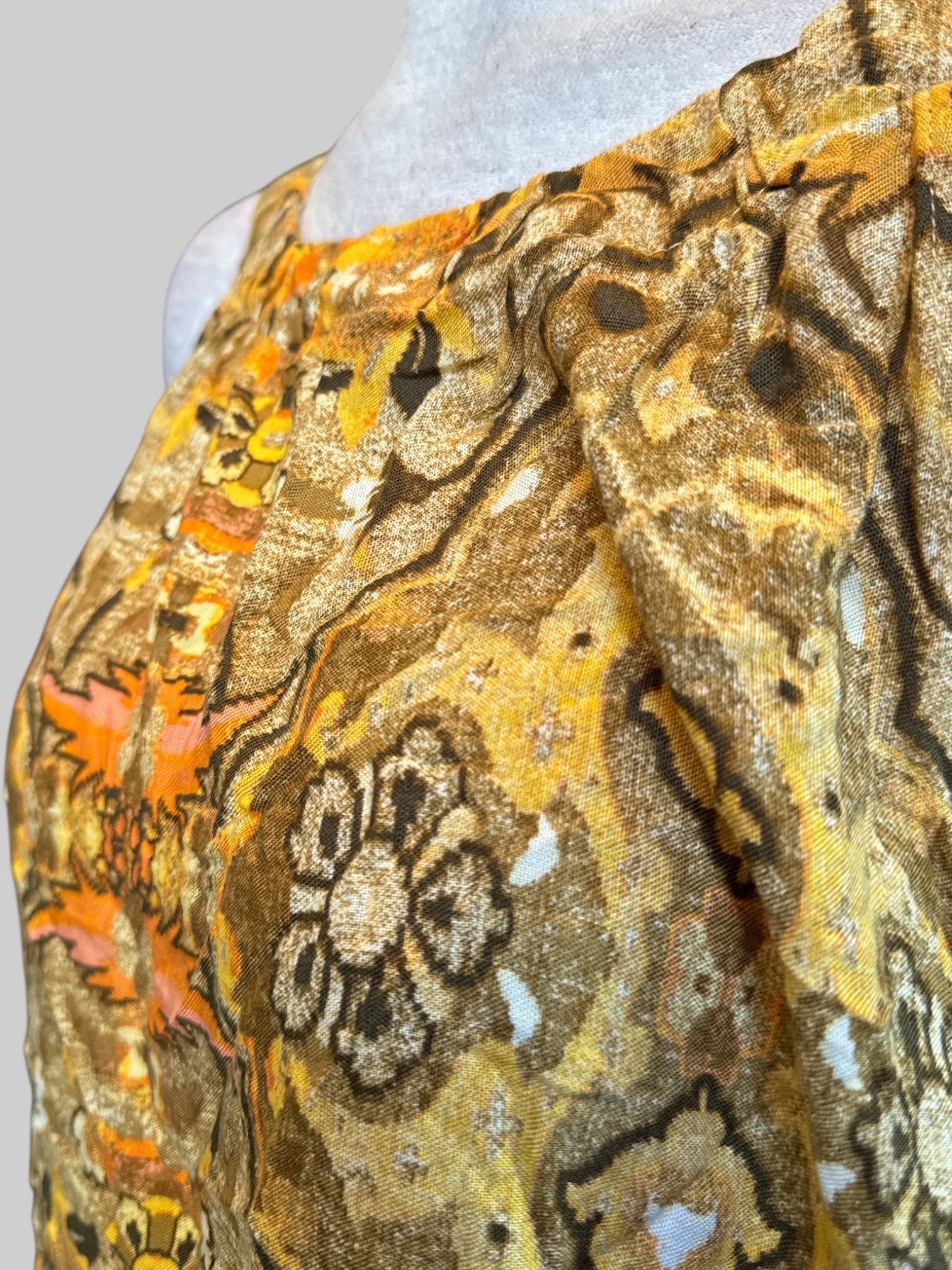 XL Brownish yellow sleeveless top with multicolor florals and geometric designs and keyhole tie back