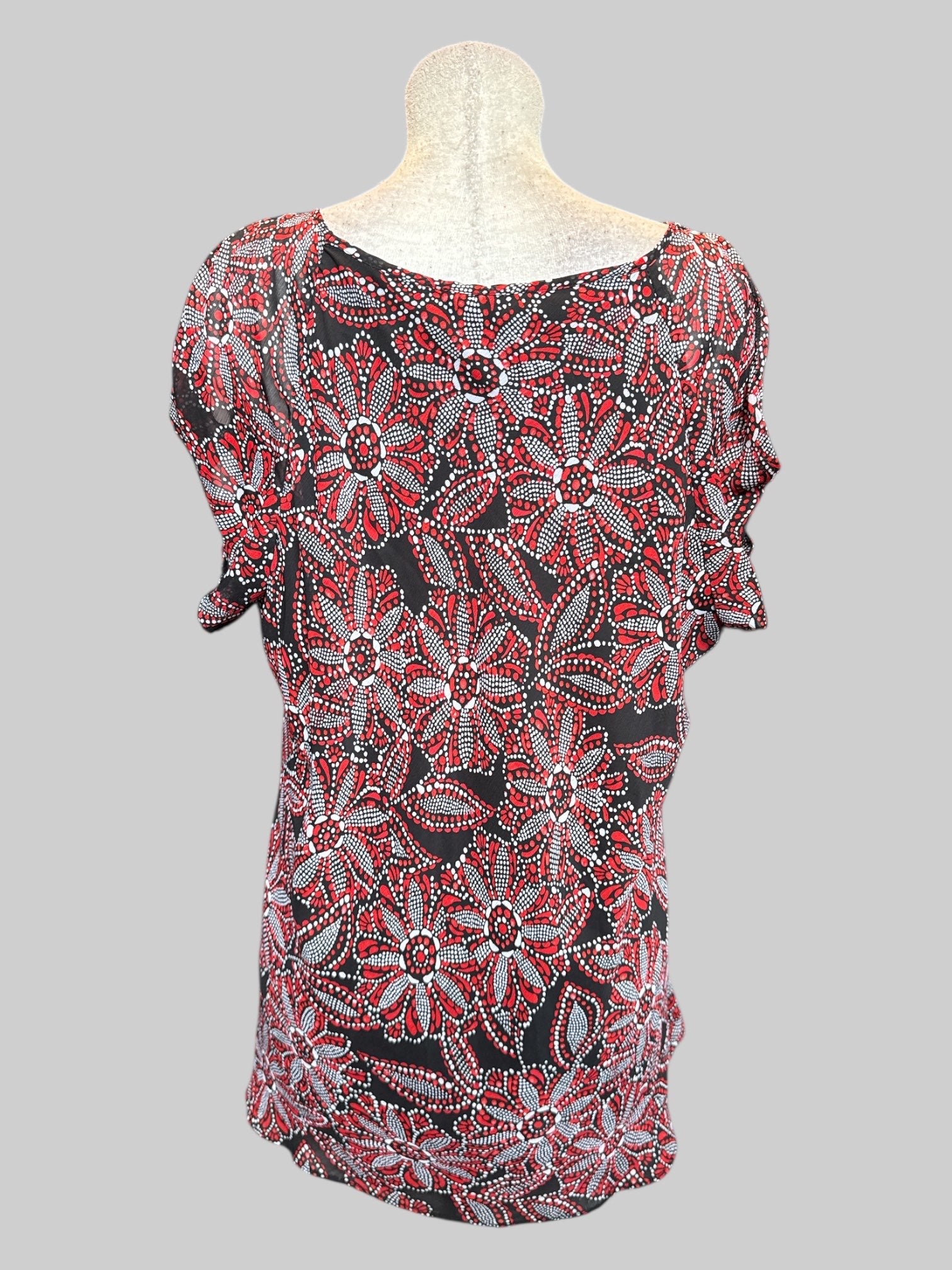 3X Black flowy top with open shoulders and red, white, and black florals