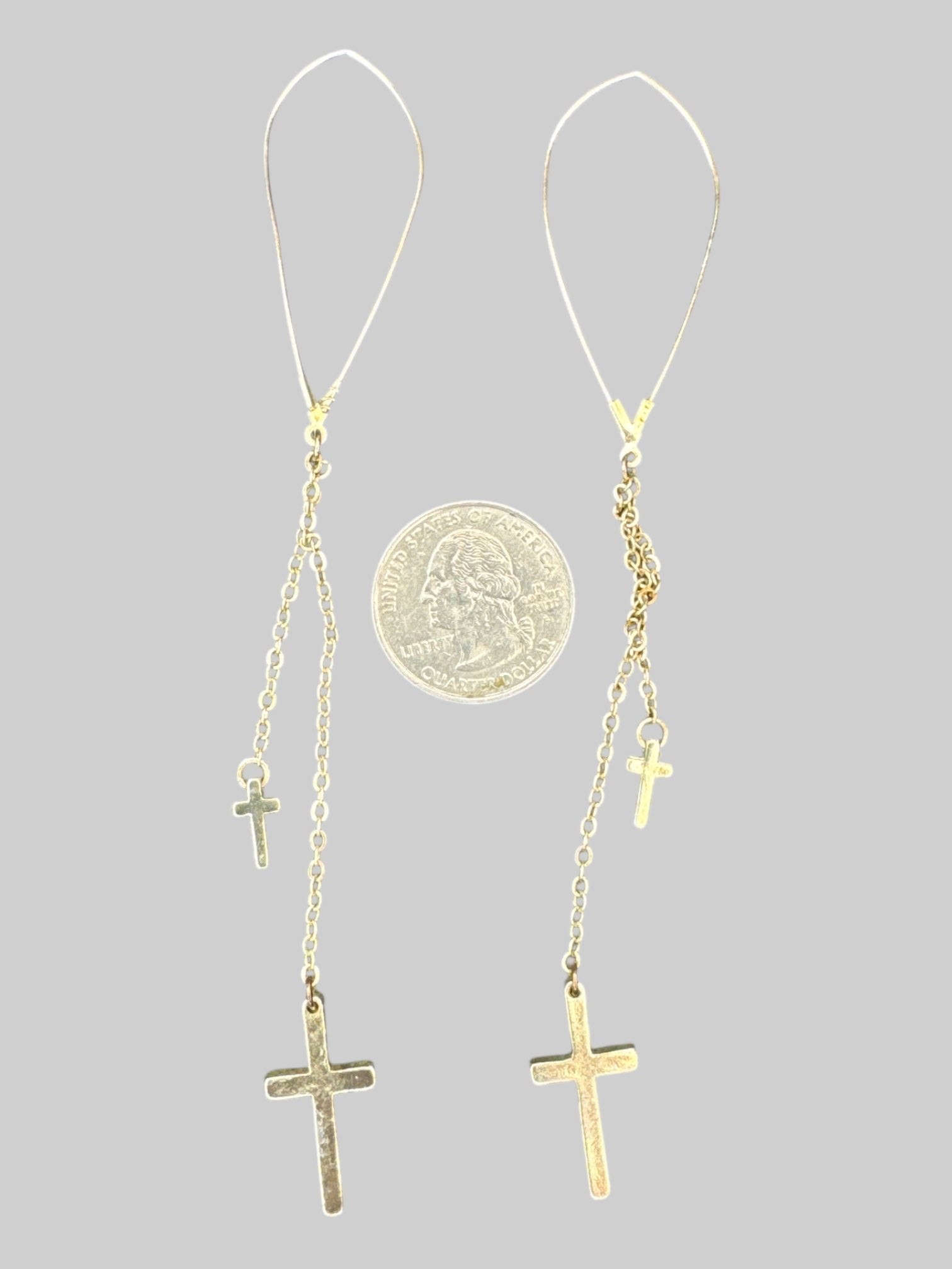 Gold tone long chain earrings with crosses