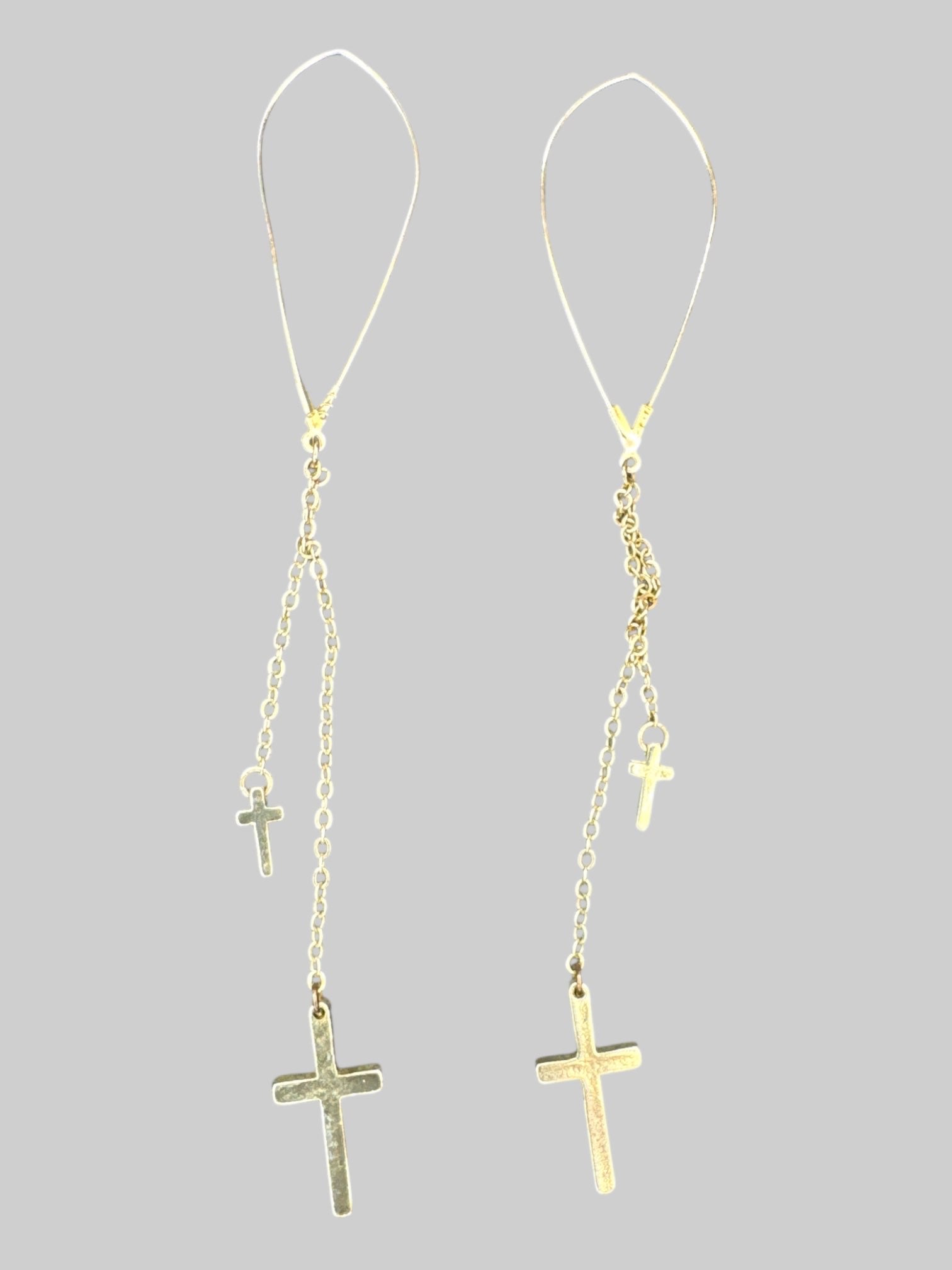 Gold tone long chain earrings with crosses
