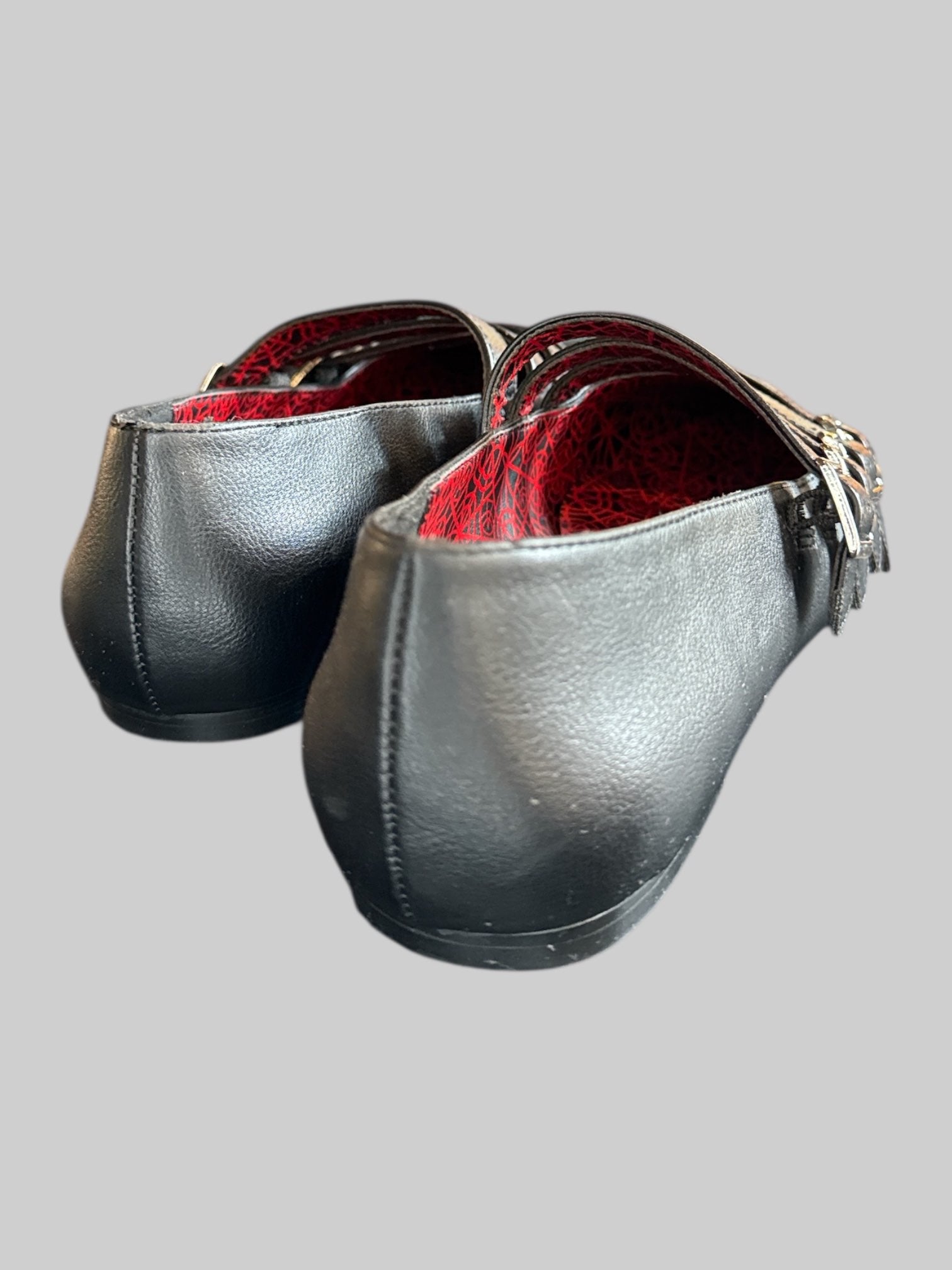 Size 10 Black pointed flats with multiple straps and red spiderweb interior