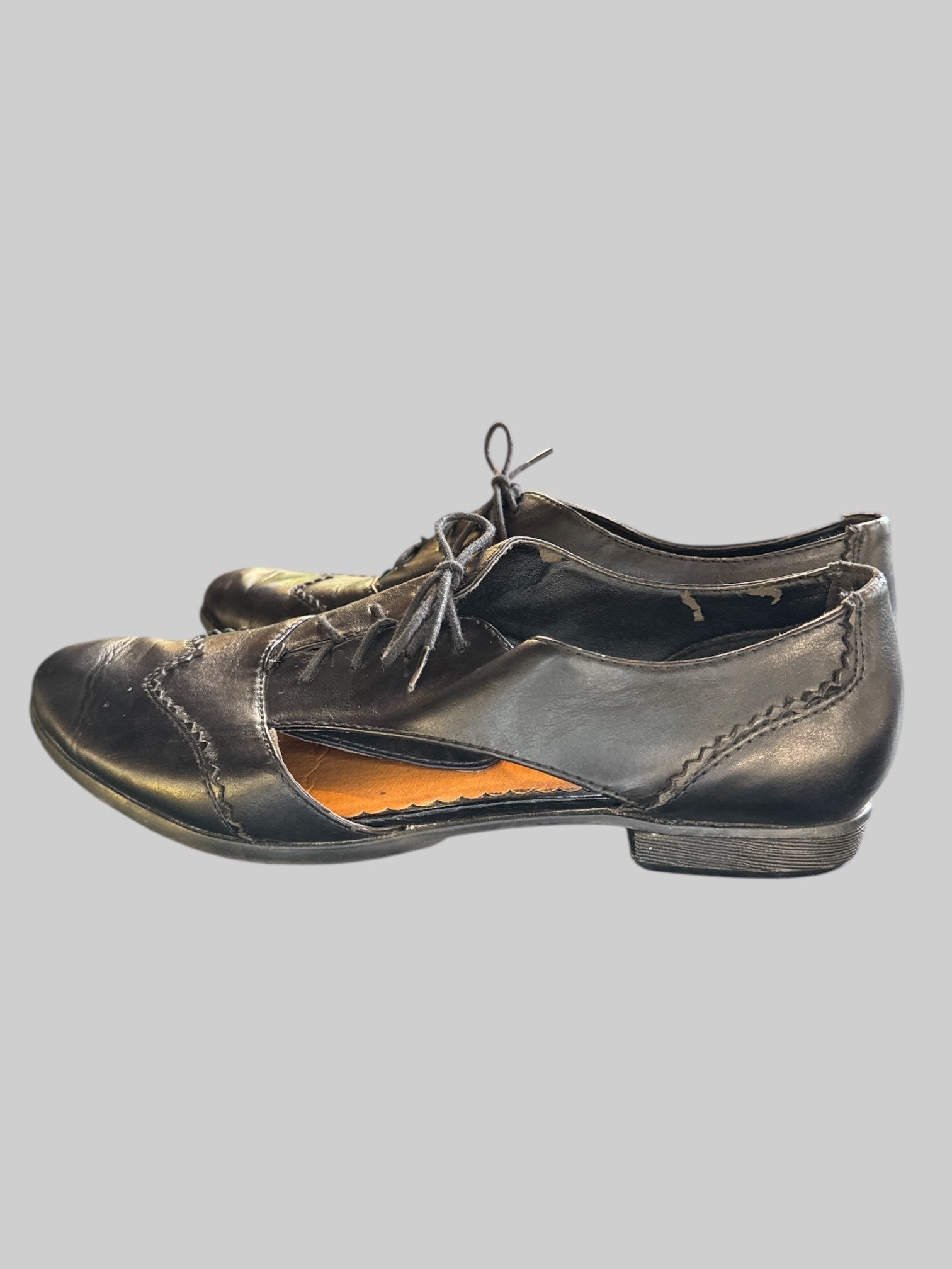 Size 9.5 black shoes with cutouts