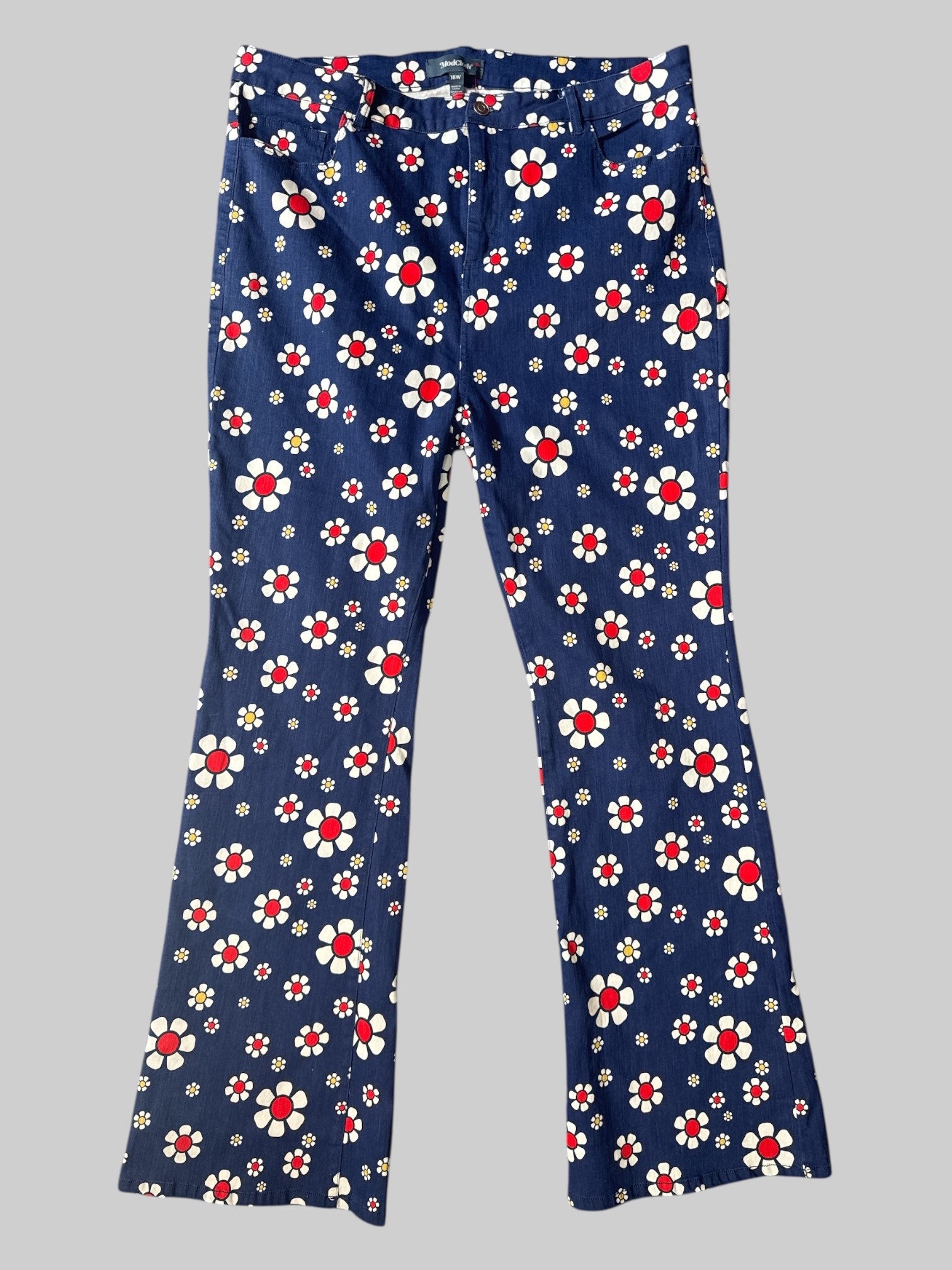 0X Denim flared leg jeans with white red and yellow floral print, pockets, and belt loops