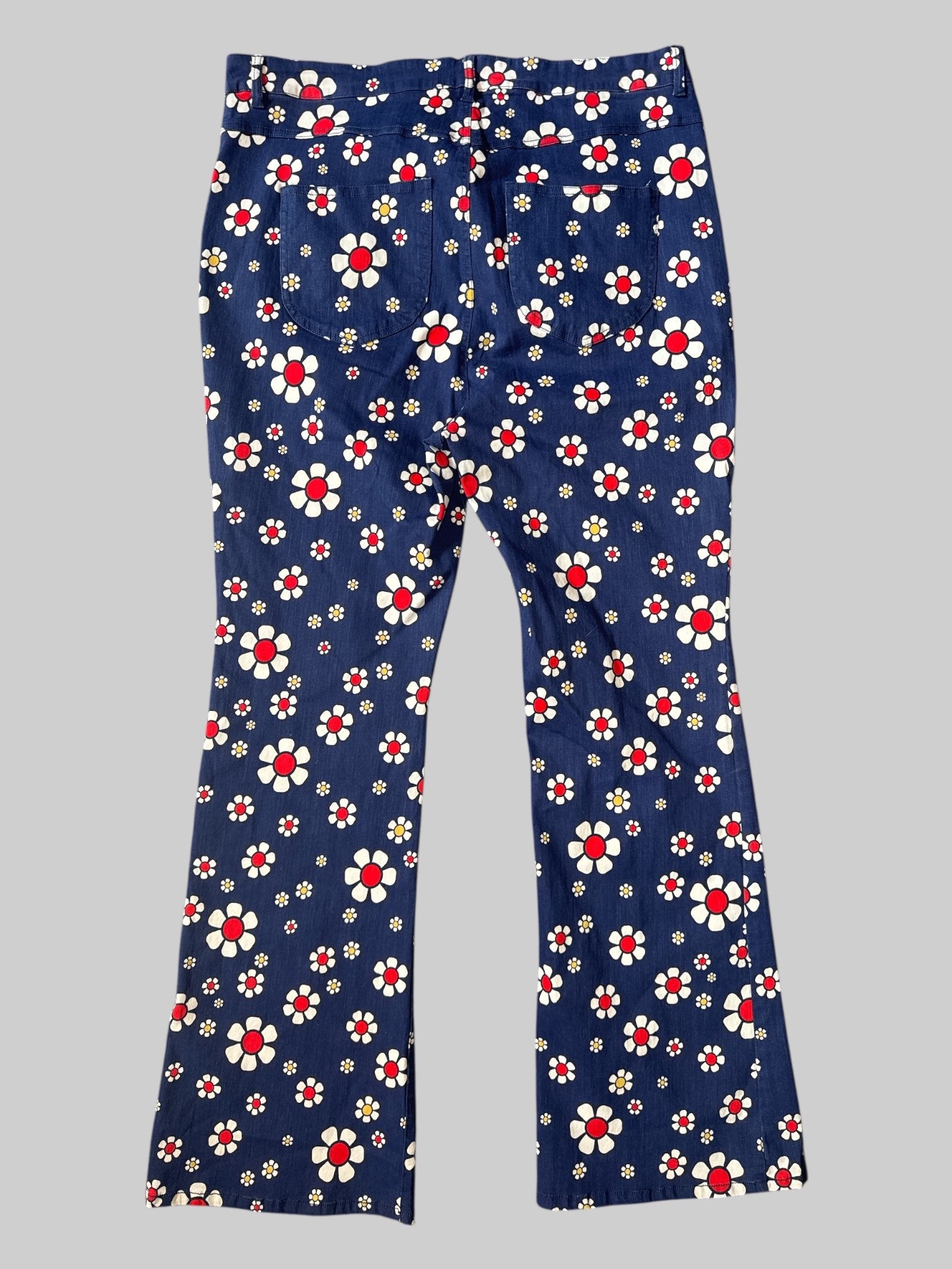 0X Denim flared leg jeans with white red and yellow floral print, pockets, and belt loops