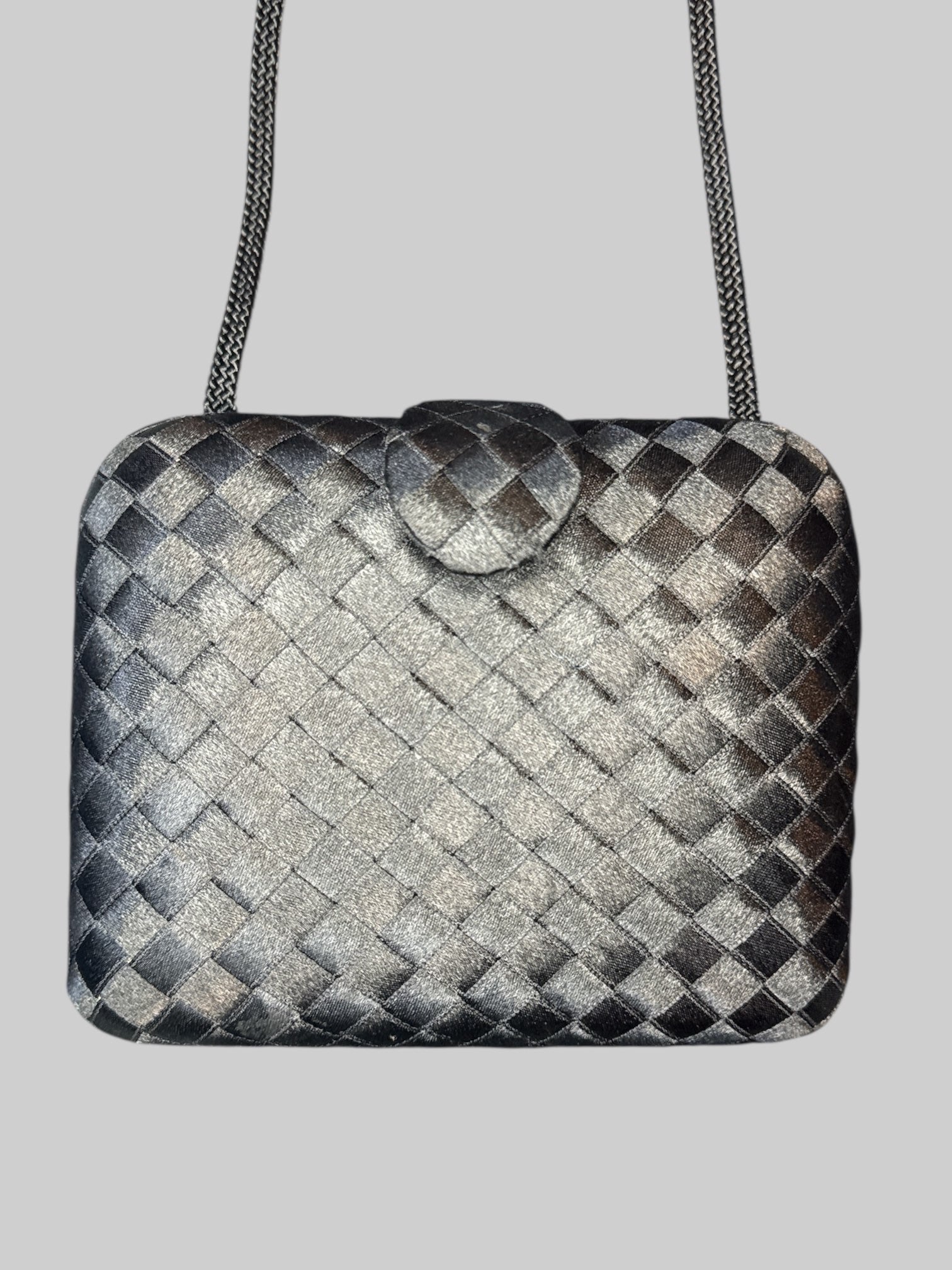 Vintage black woven purse with braided shoulder strap, snap button claspe, and multiple pockets