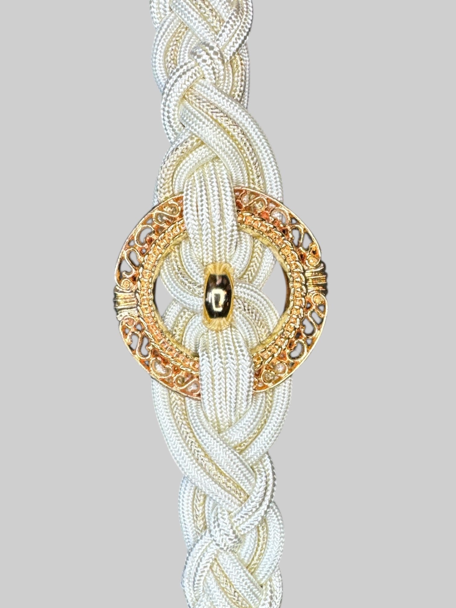 White braided belt with gold tone circle pendant, and hook clasp