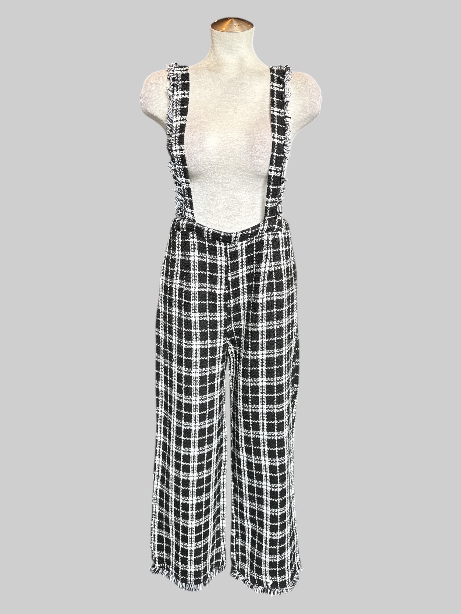 M Black and white plaid jumper with fringe on straps and bottom of pants