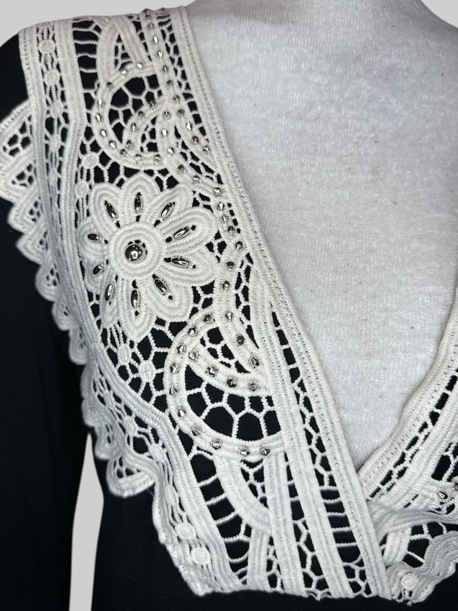XL Black long sleeve top with bell sleeves and cream embroidery with beads
