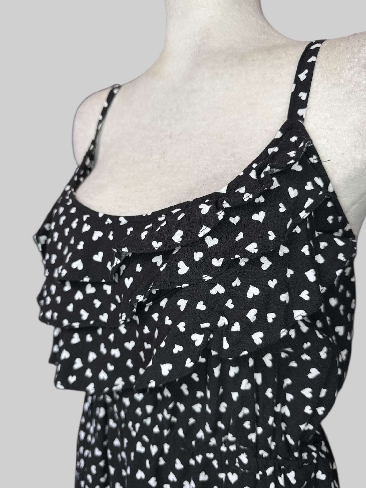 4X Flowy black top with white hearts and ruffle layers