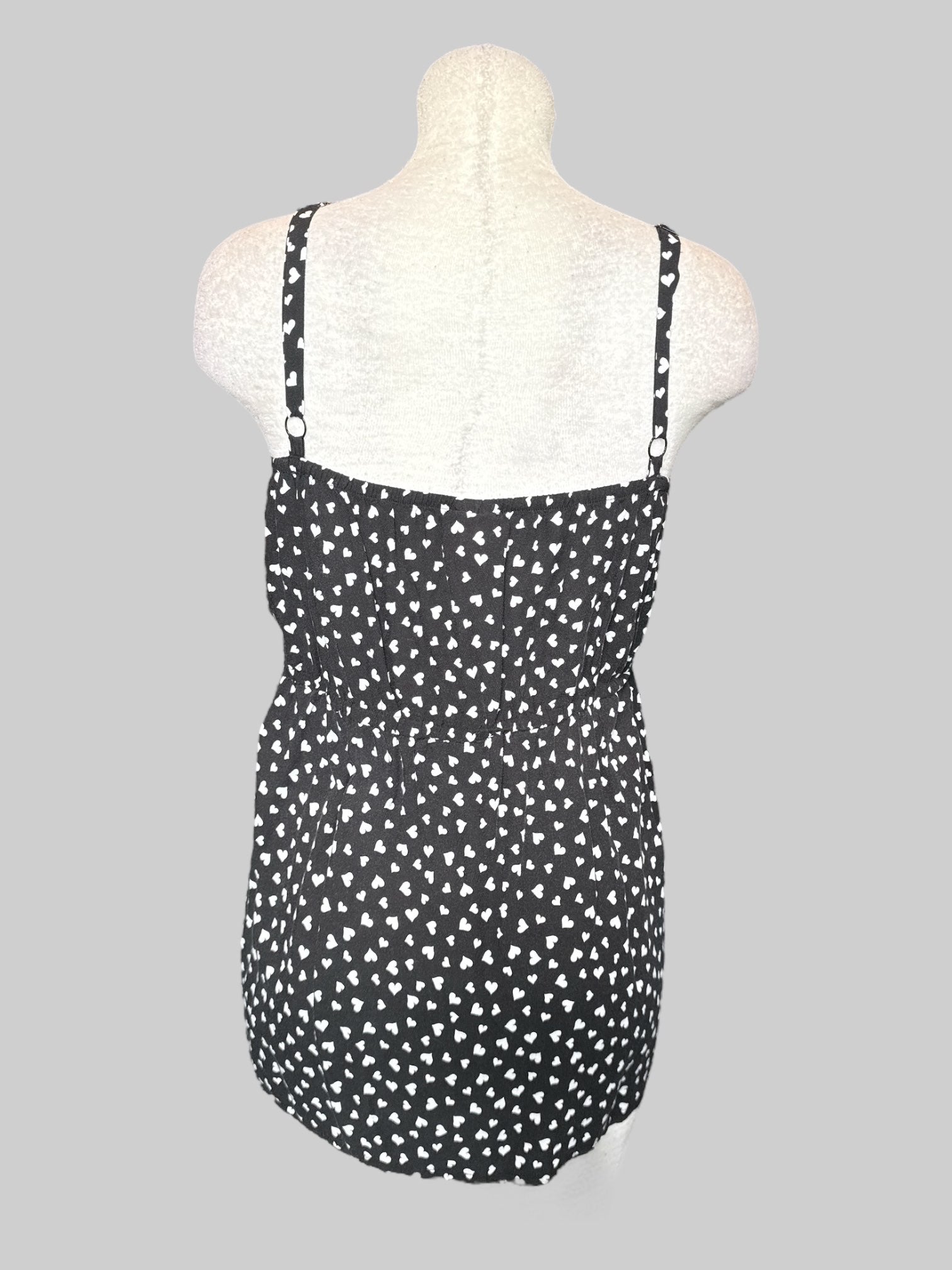 4X Flowy black top with white hearts and ruffle layers