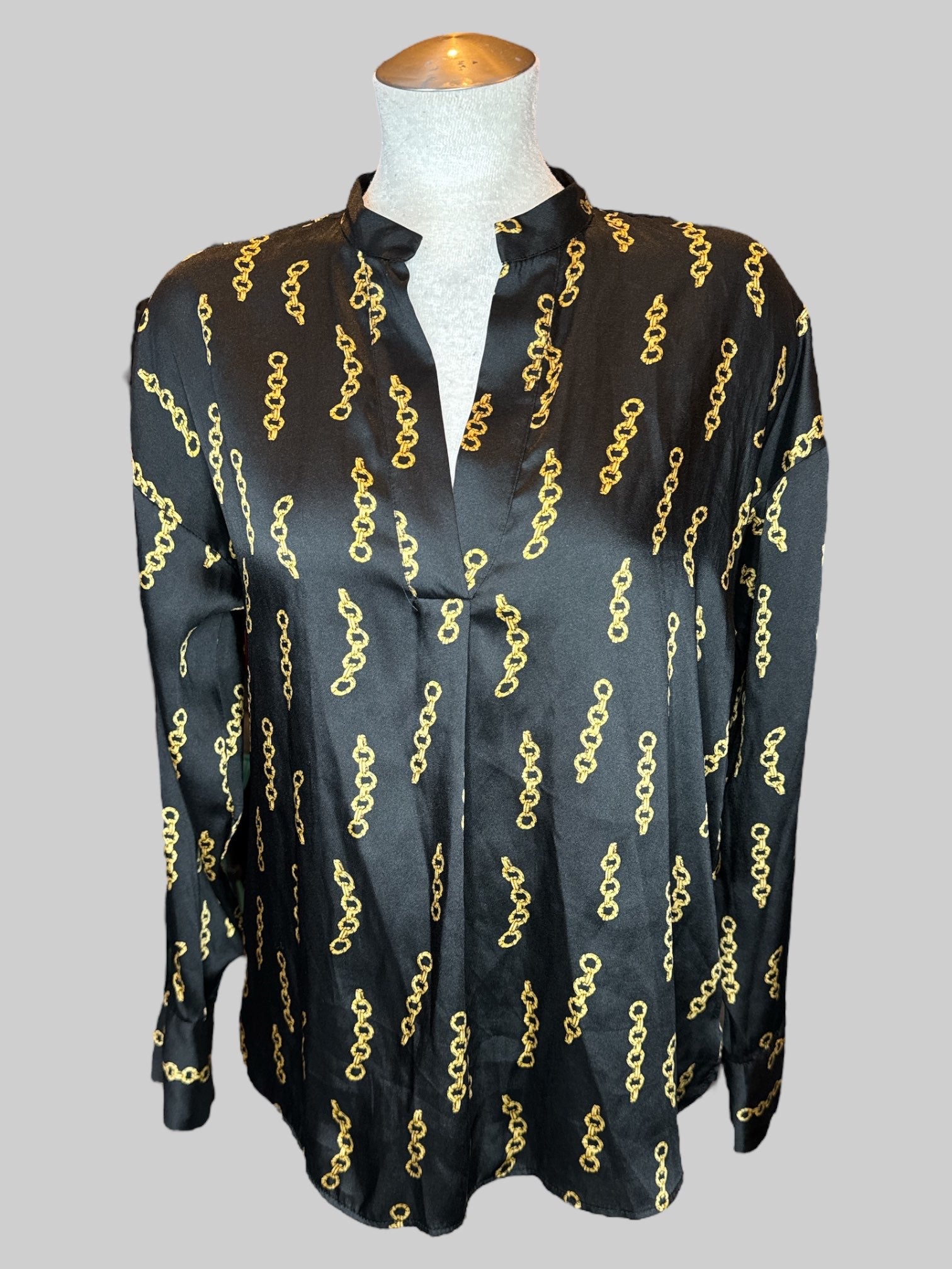 L Black flowy tunic style top with gold chains pattern