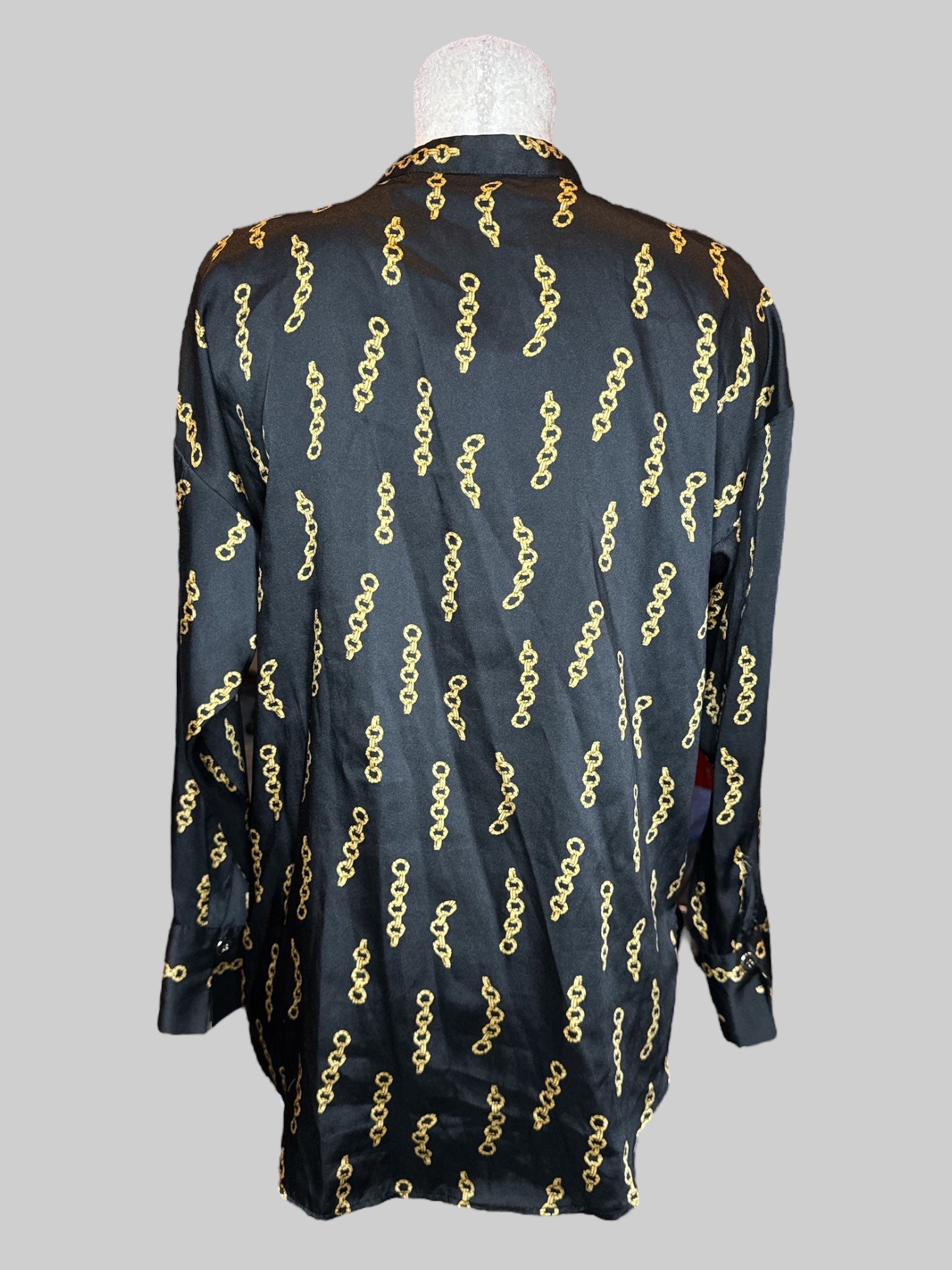 L Black flowy tunic style top with gold chains pattern