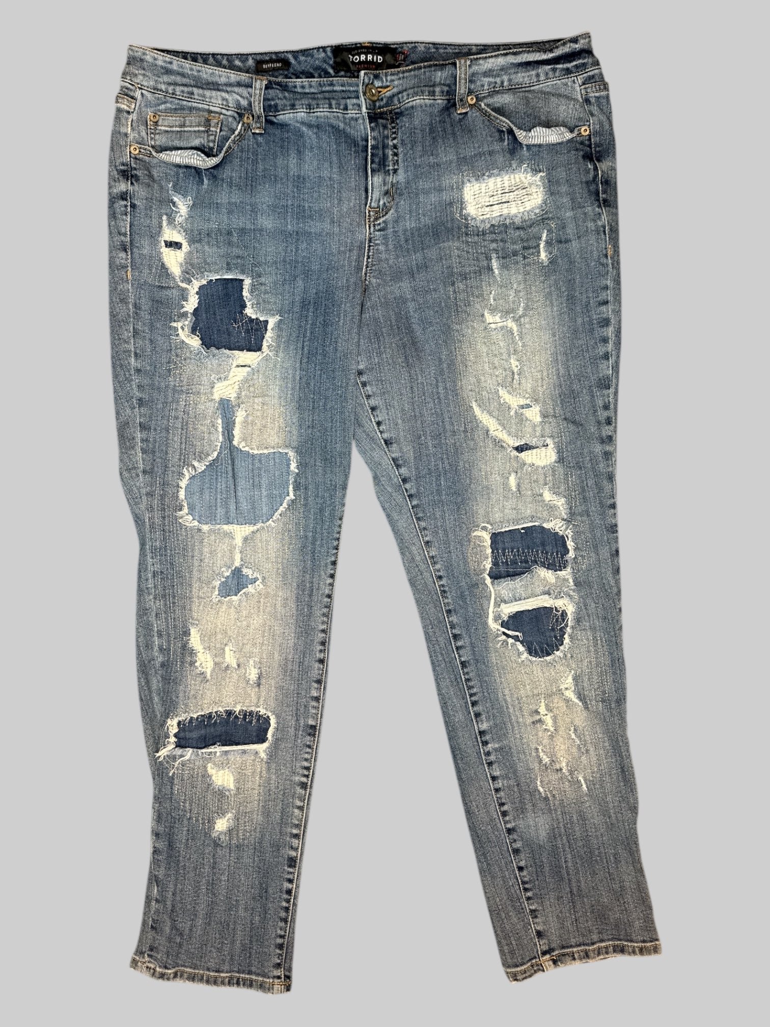 0X Distressed and patched boyfriend style blue jeans