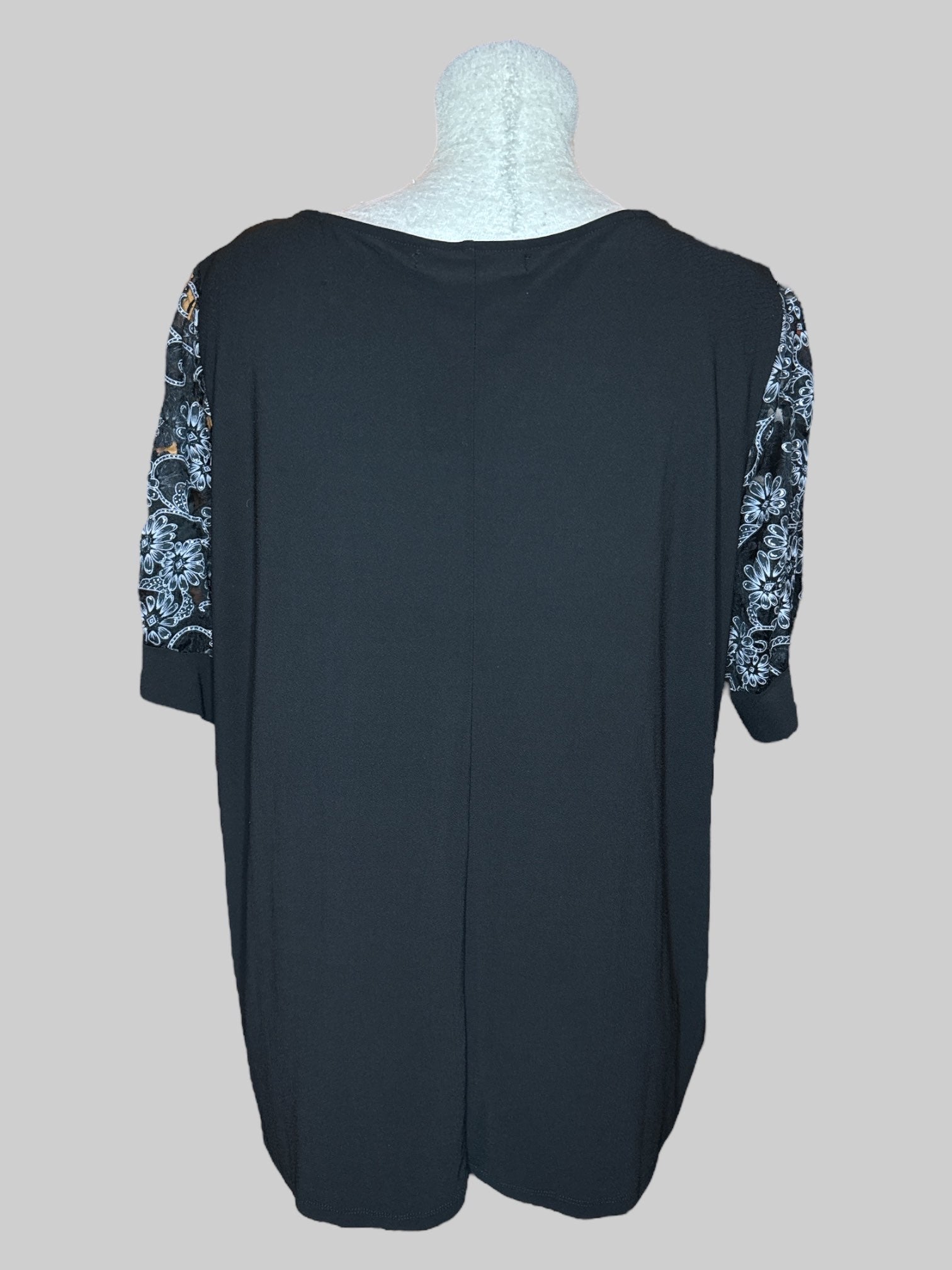 4X Black V-neck top with sheer sleeves with black, gray, and silver florals