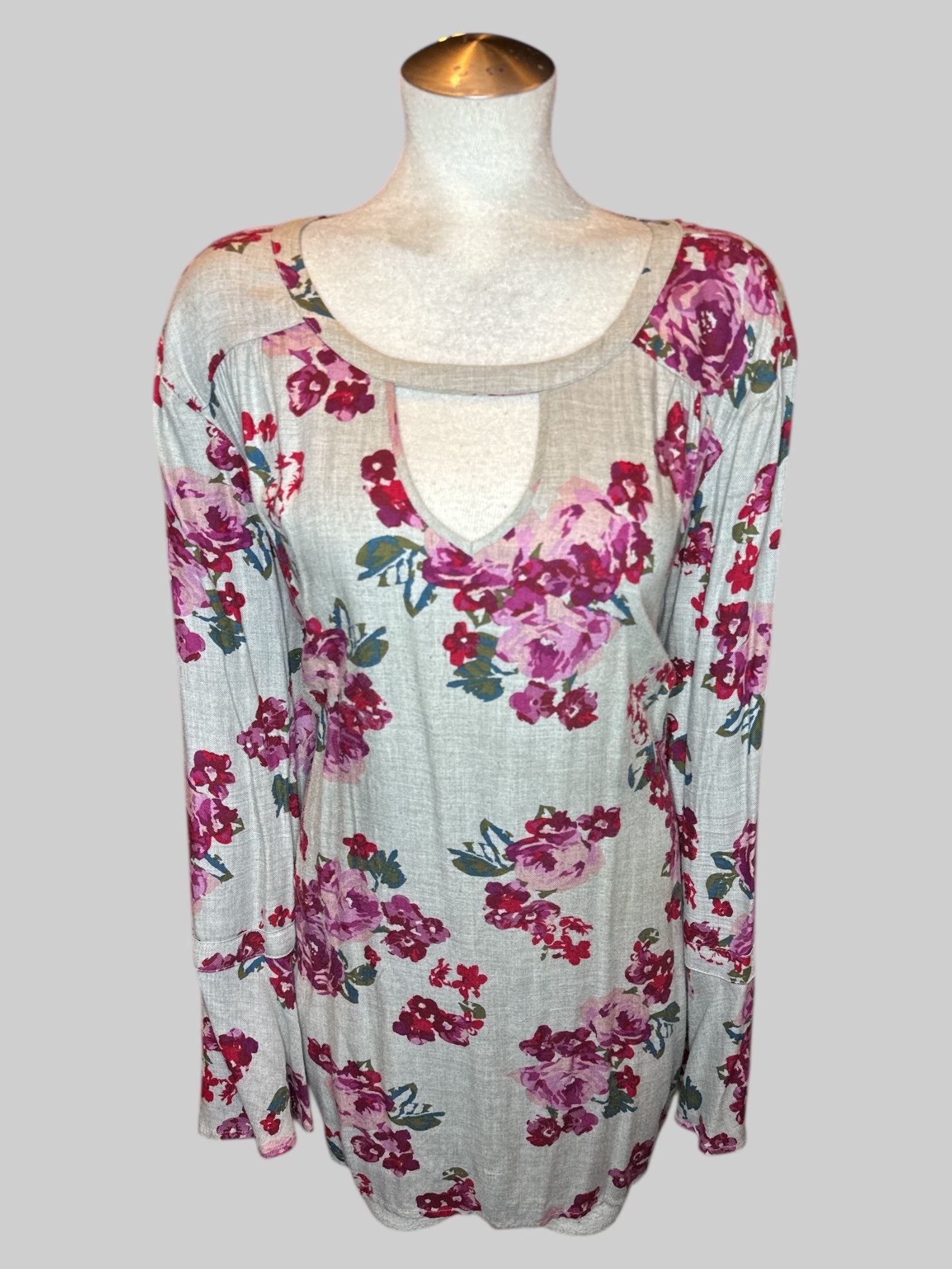 5X Grey long sleeve top with purple red green and blue florals, chest cut out, keyhole back, and flowy sleeves