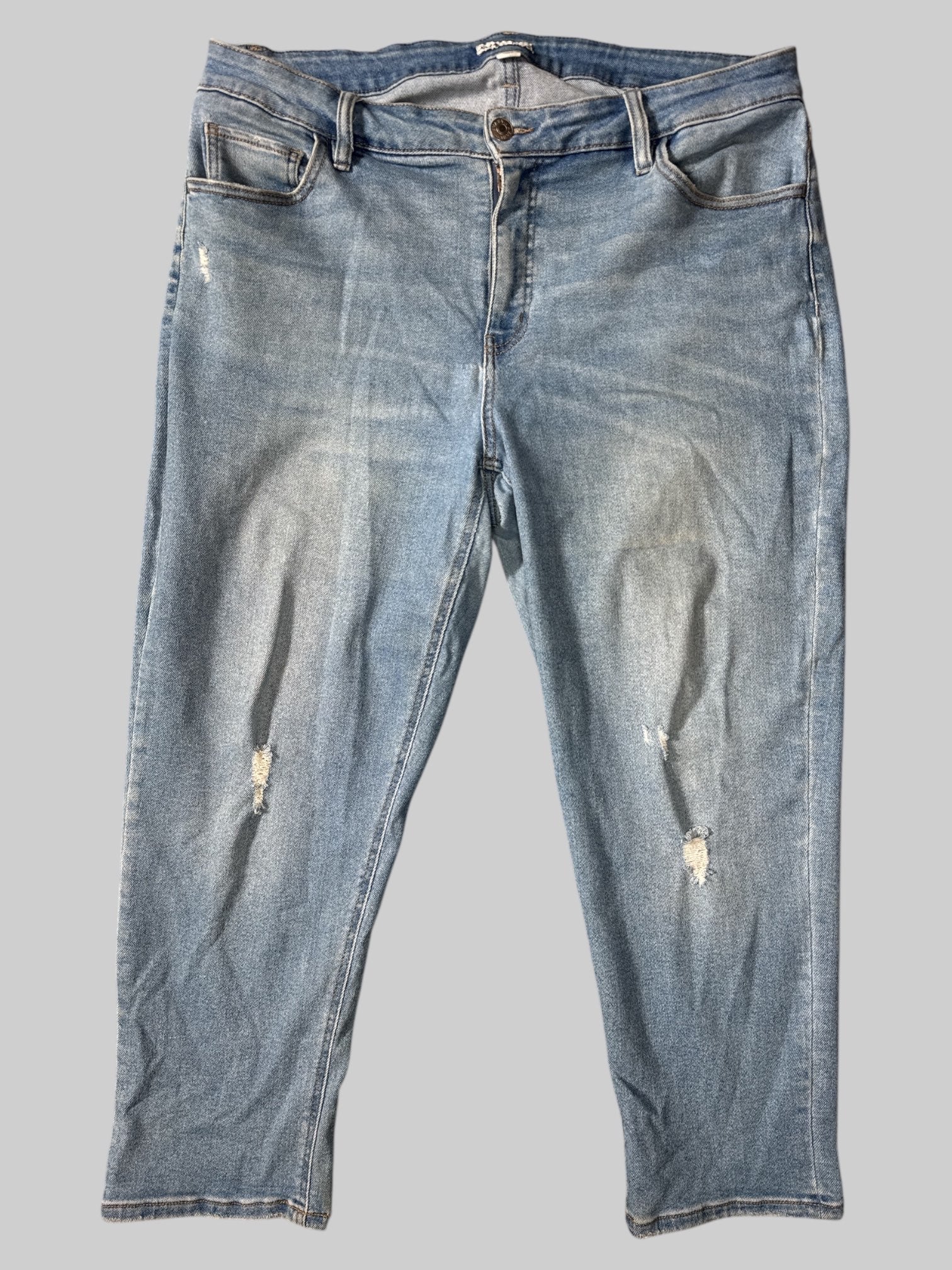 1X Blue jeans with belt loops, pockets, and distressing on knees