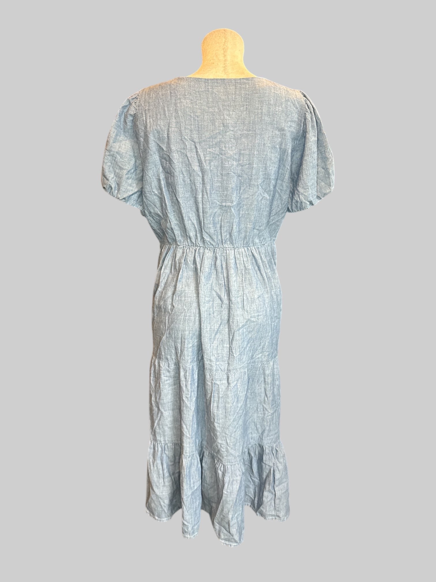 1X Blue denim short sleeve dress with balloon sleeves, pockets, and tiered skirt