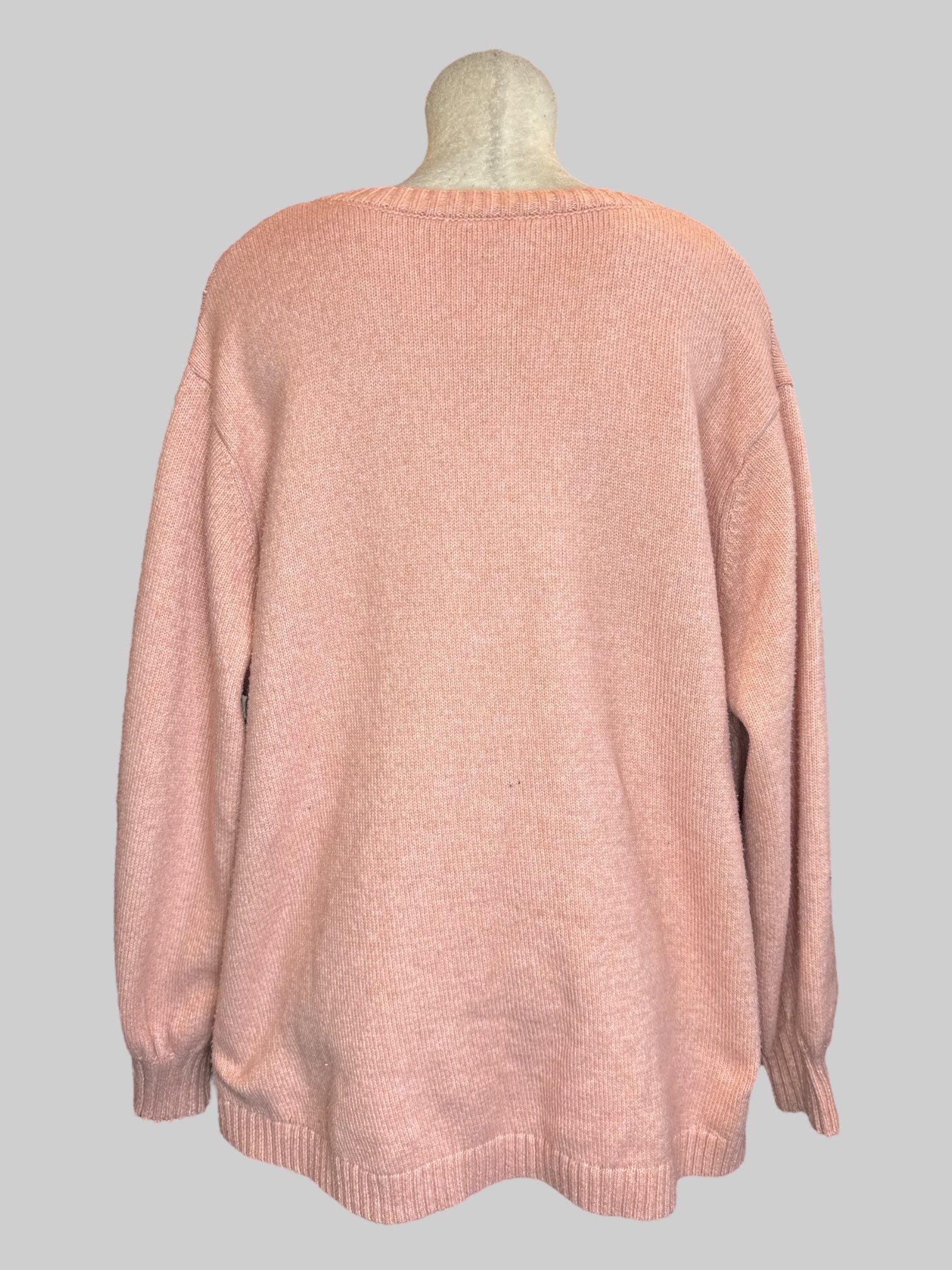 6X Pink knit sweater with crisscross design on front and cuffs