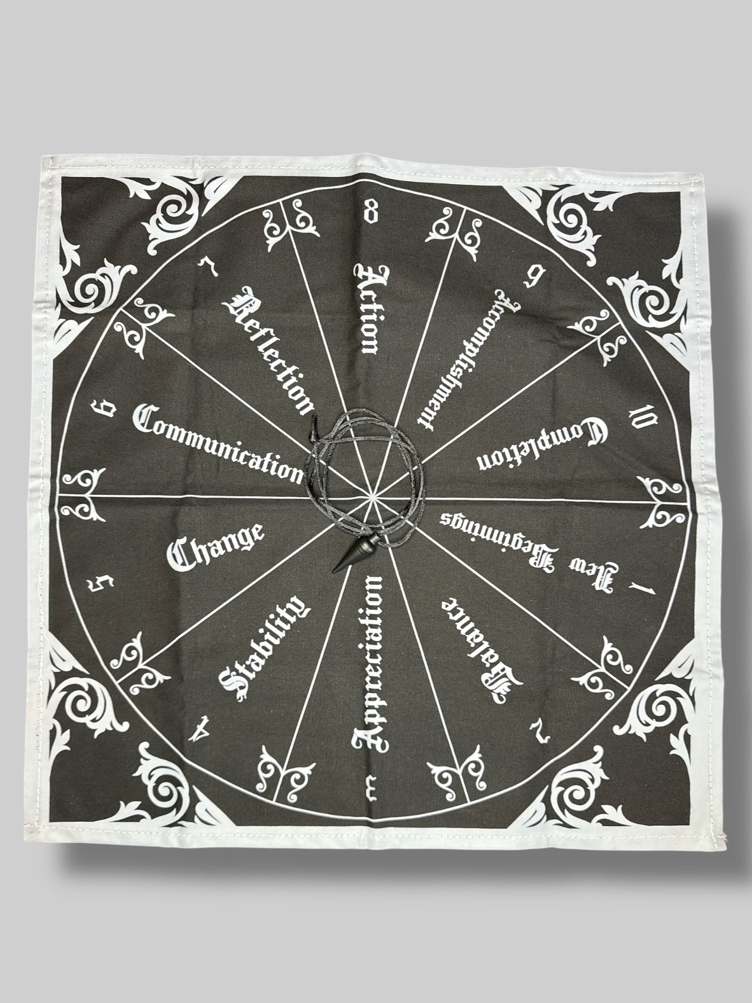 Black and grey alter cloth with 10 step circle, and black metal pendulum