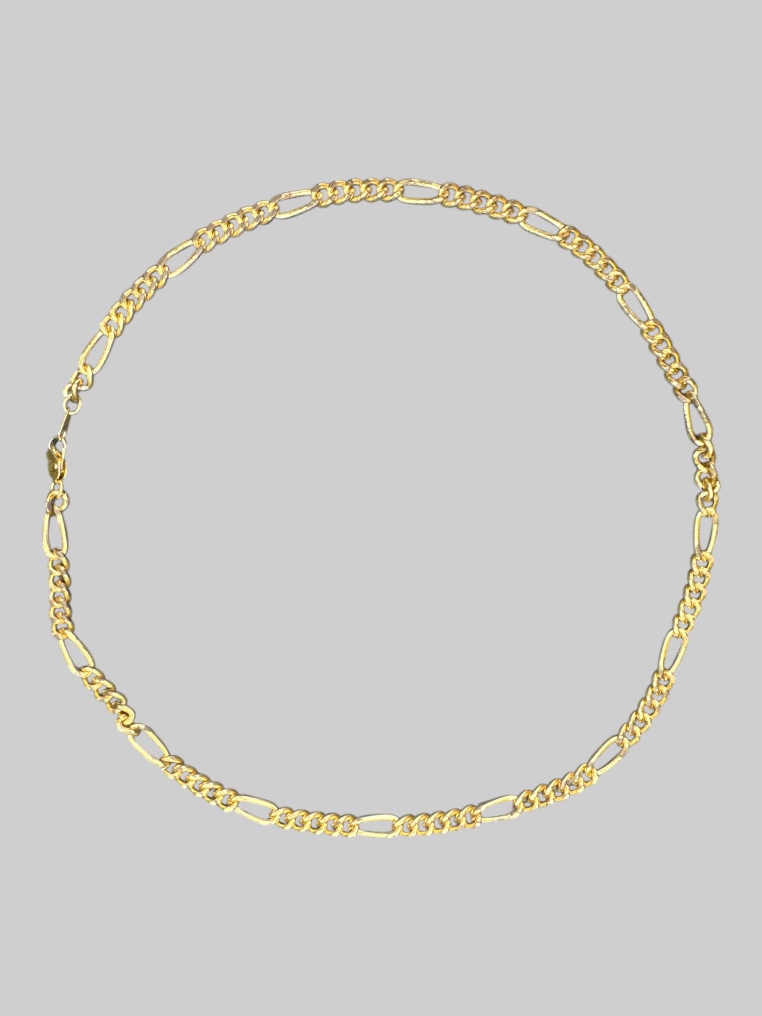 Gold tone chain necklace with clasp closure