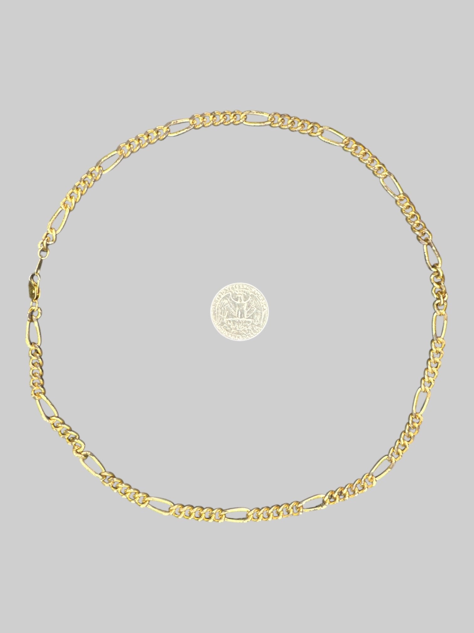 Gold tone chain necklace with clasp closure
