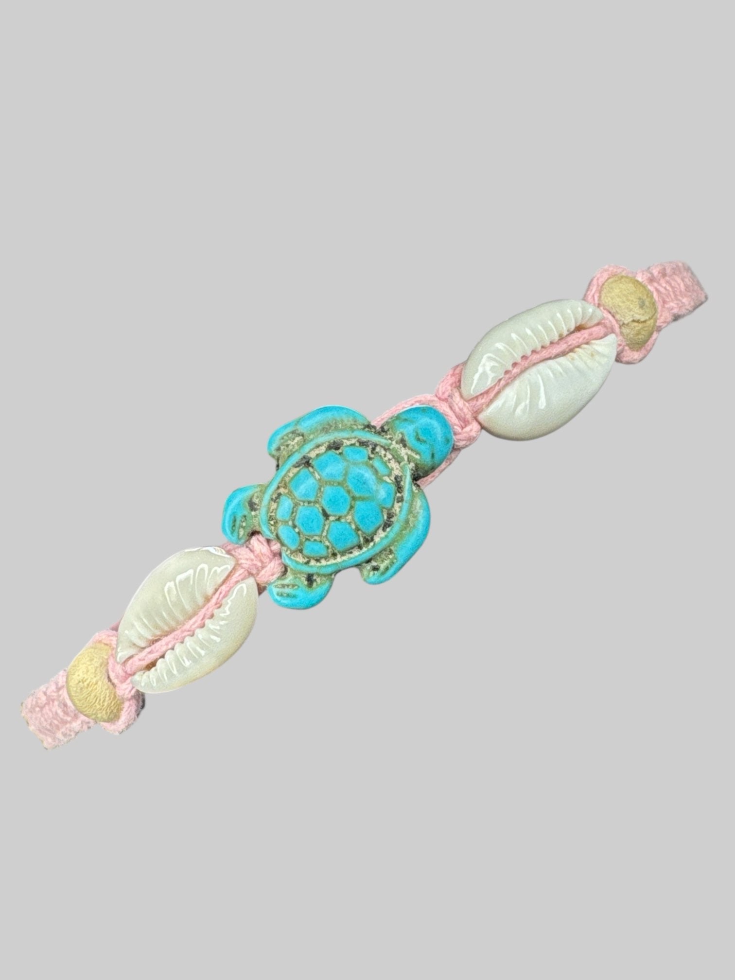 Pink adjustable threaded bracelet with shells and turquoise turtle