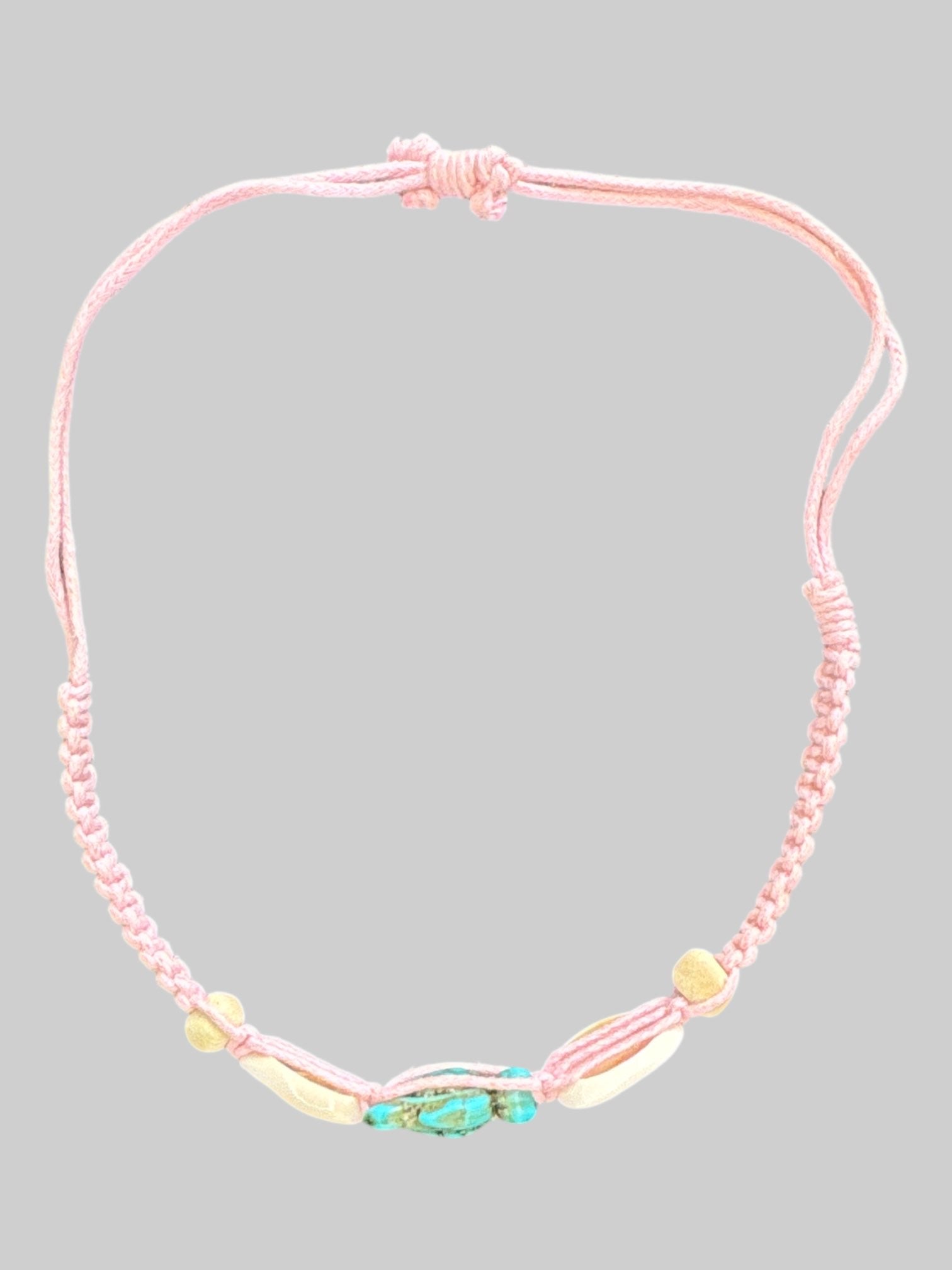 Pink adjustable threaded bracelet with shells and turquoise turtle