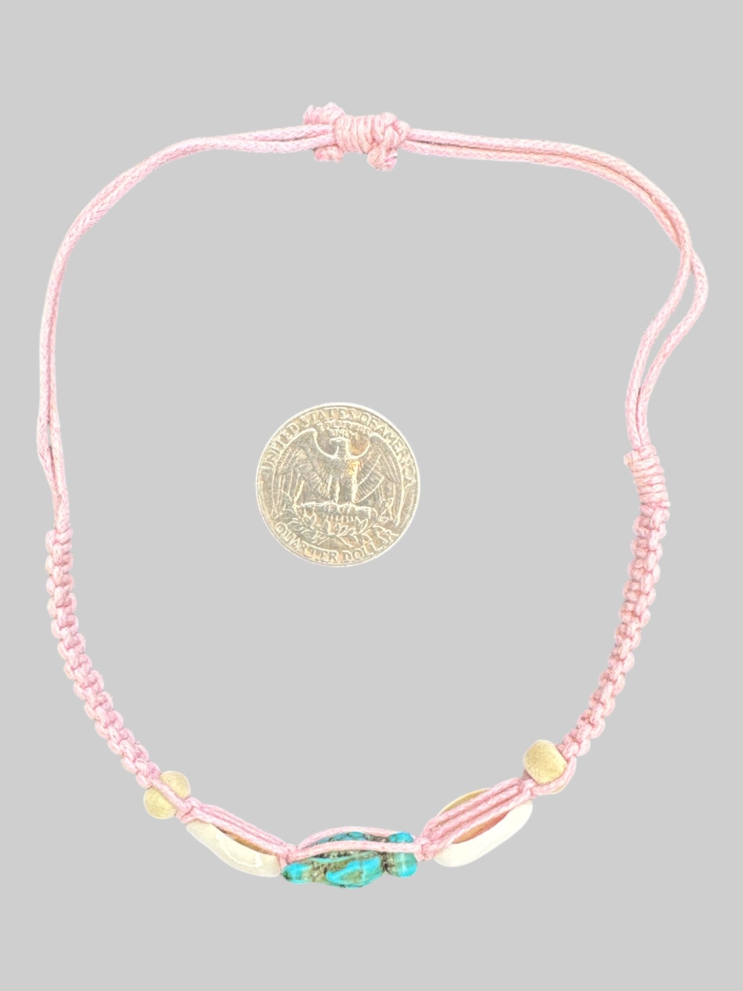 Pink adjustable threaded bracelet with shells and turquoise turtle