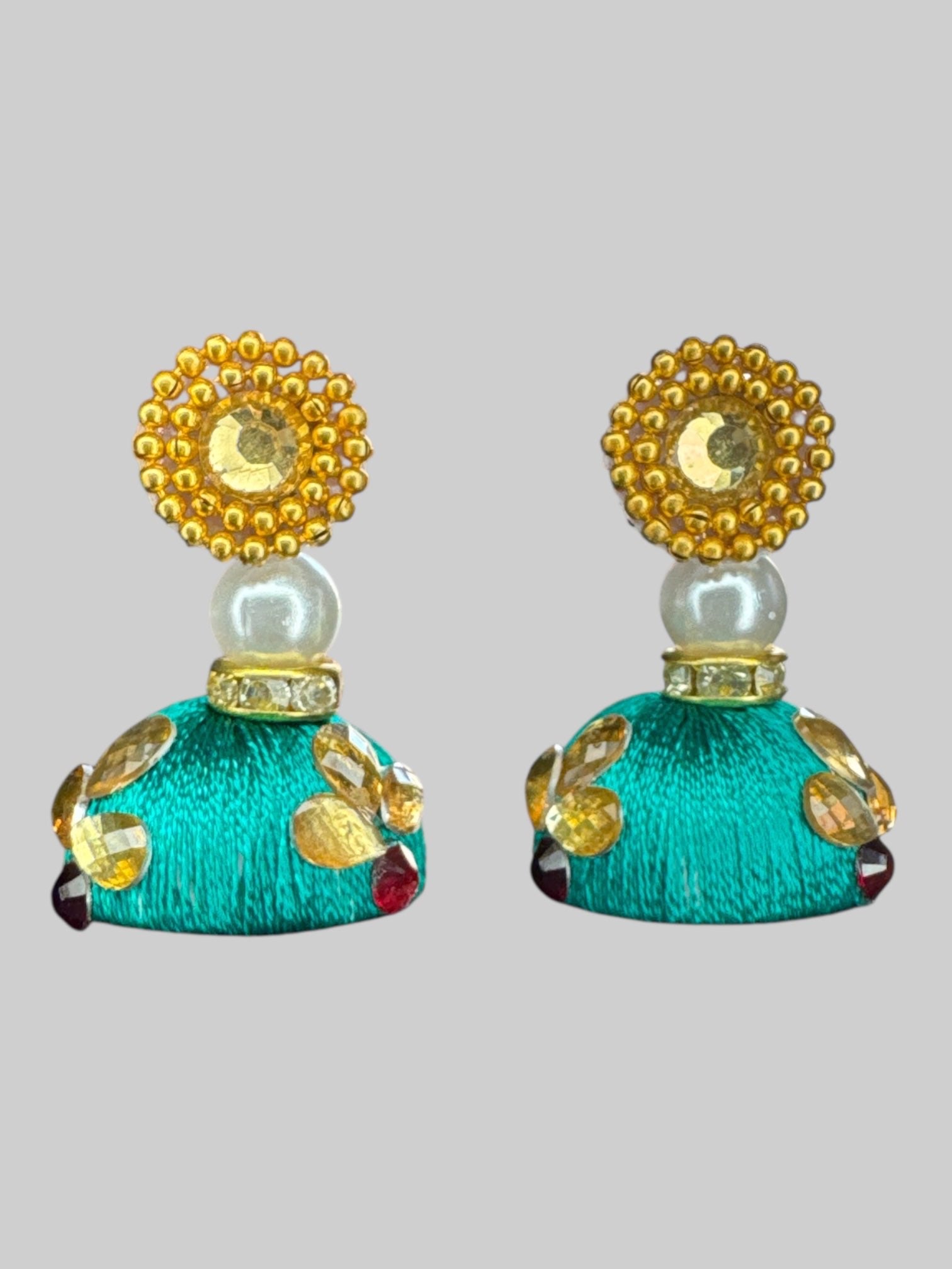 Green and gold earrings with detachable, pendants, and bedazzling