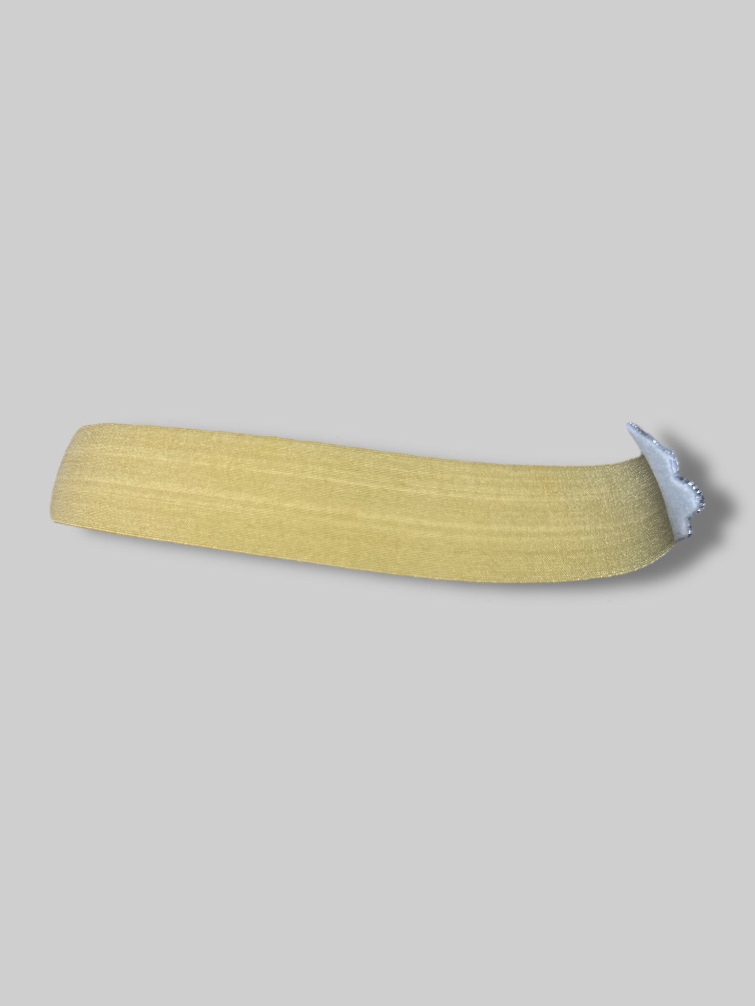 Gold stretchy headband with bedazzled pendant