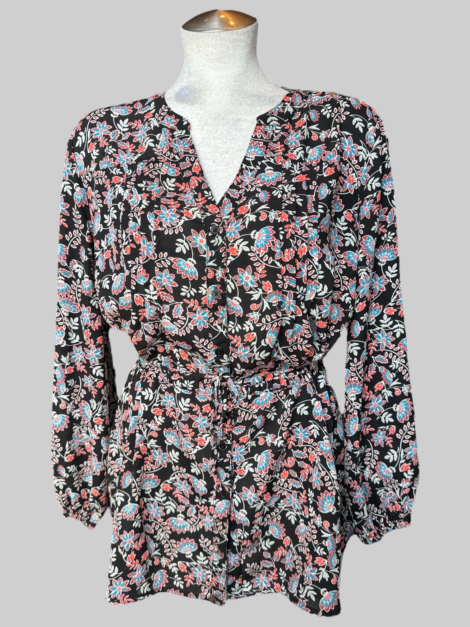 1X Black flowy button up long sleeve shirt with chest pleating, waist band tie, and red, white, and blue florals