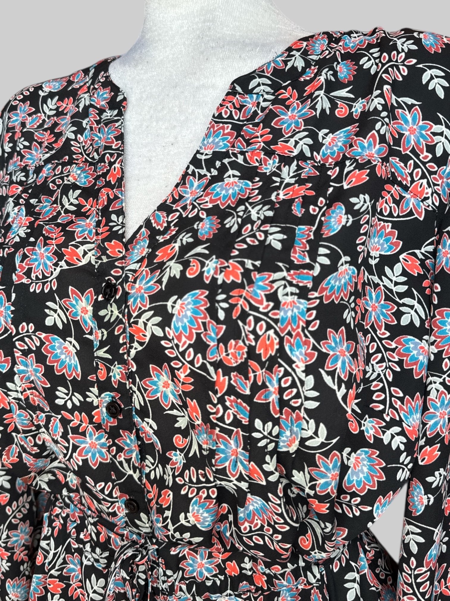 1X Black flowy button up long sleeve shirt with chest pleating, waist band tie, and red, white, and blue florals