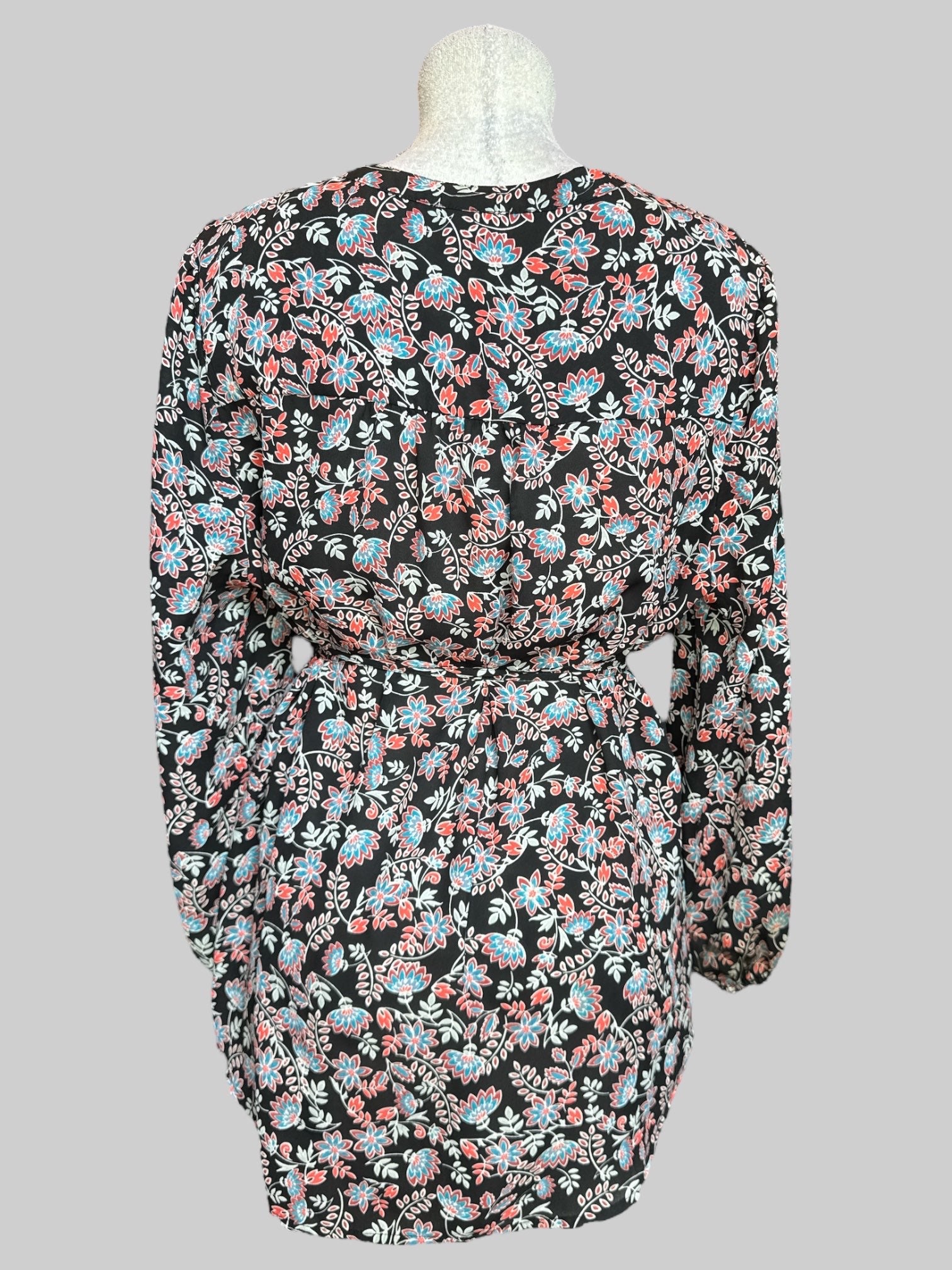 1X Black flowy button up long sleeve shirt with chest pleating, waist band tie, and red, white, and blue florals