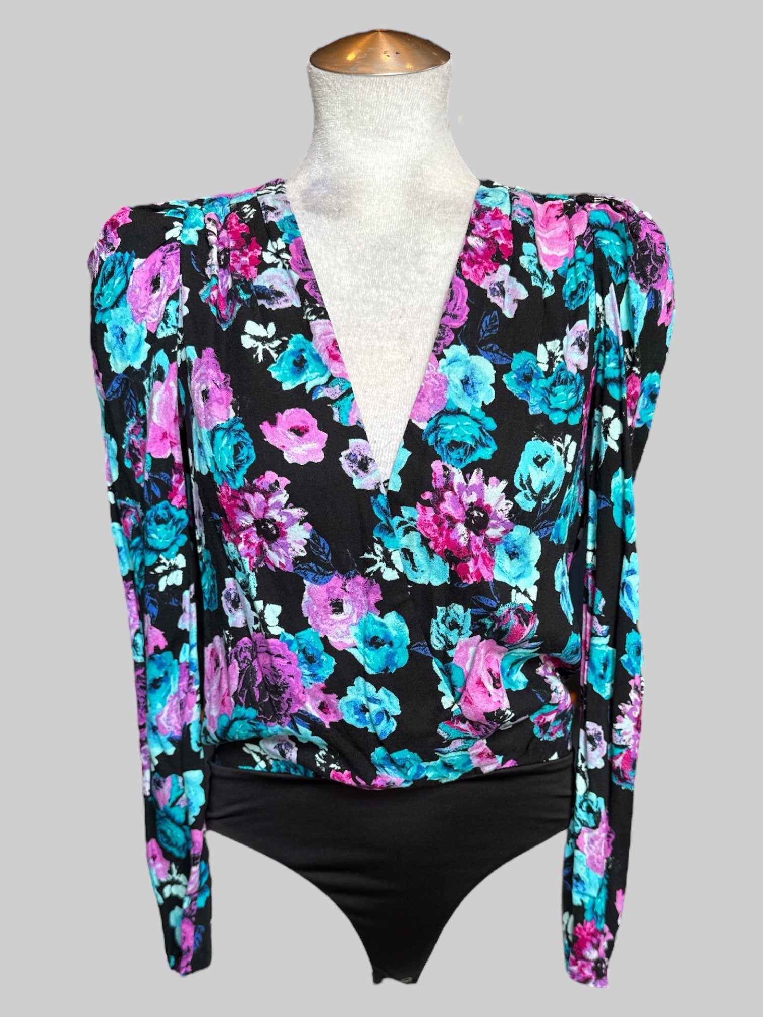 M NWT Nordstrom black body suit with blue and purple, pink florals and pleated sleeves