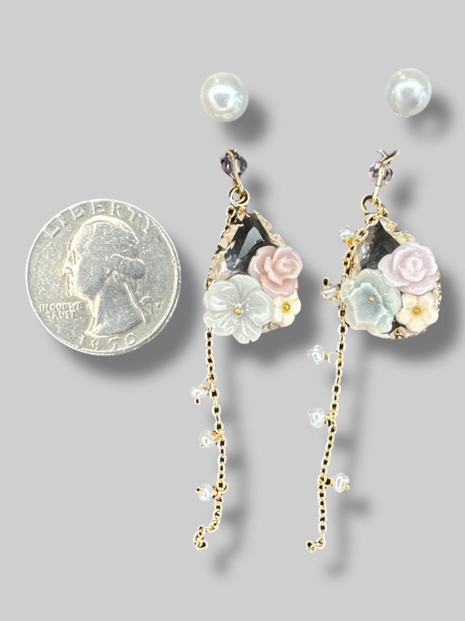 Beautiful dangle earrings with gold color chains, florals, and pearl studs
