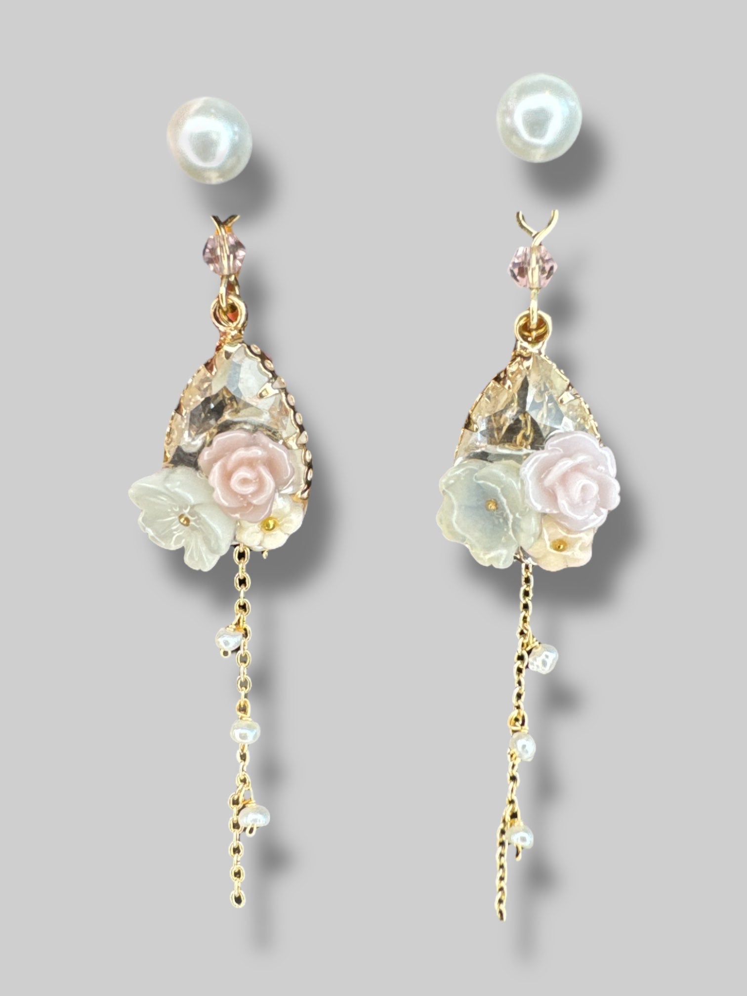 Beautiful dangle earrings with gold color chains, florals, and pearl studs