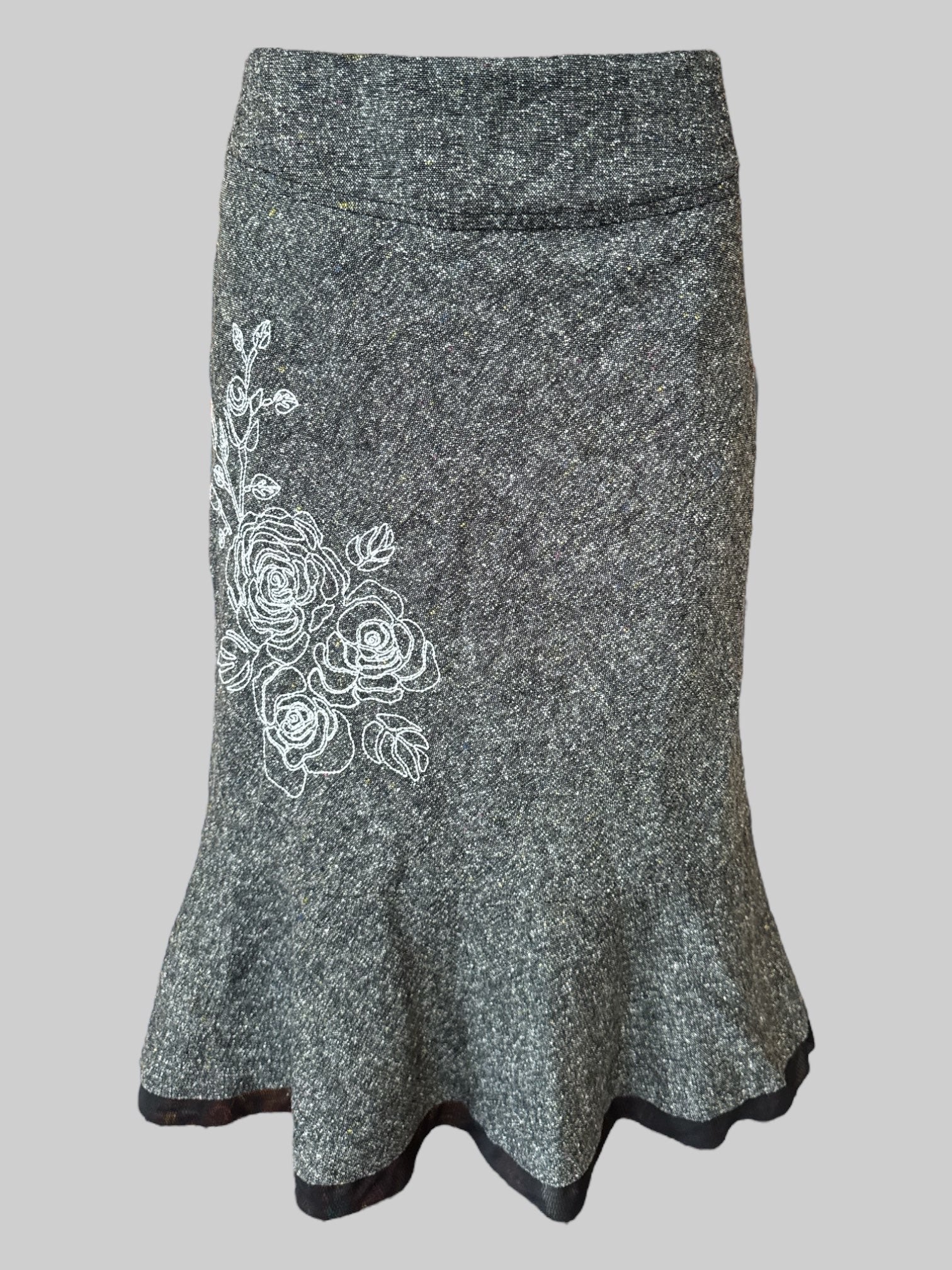 L Vintage grey skirt with speckles of yellow and red, white floral embroidery, and black trim