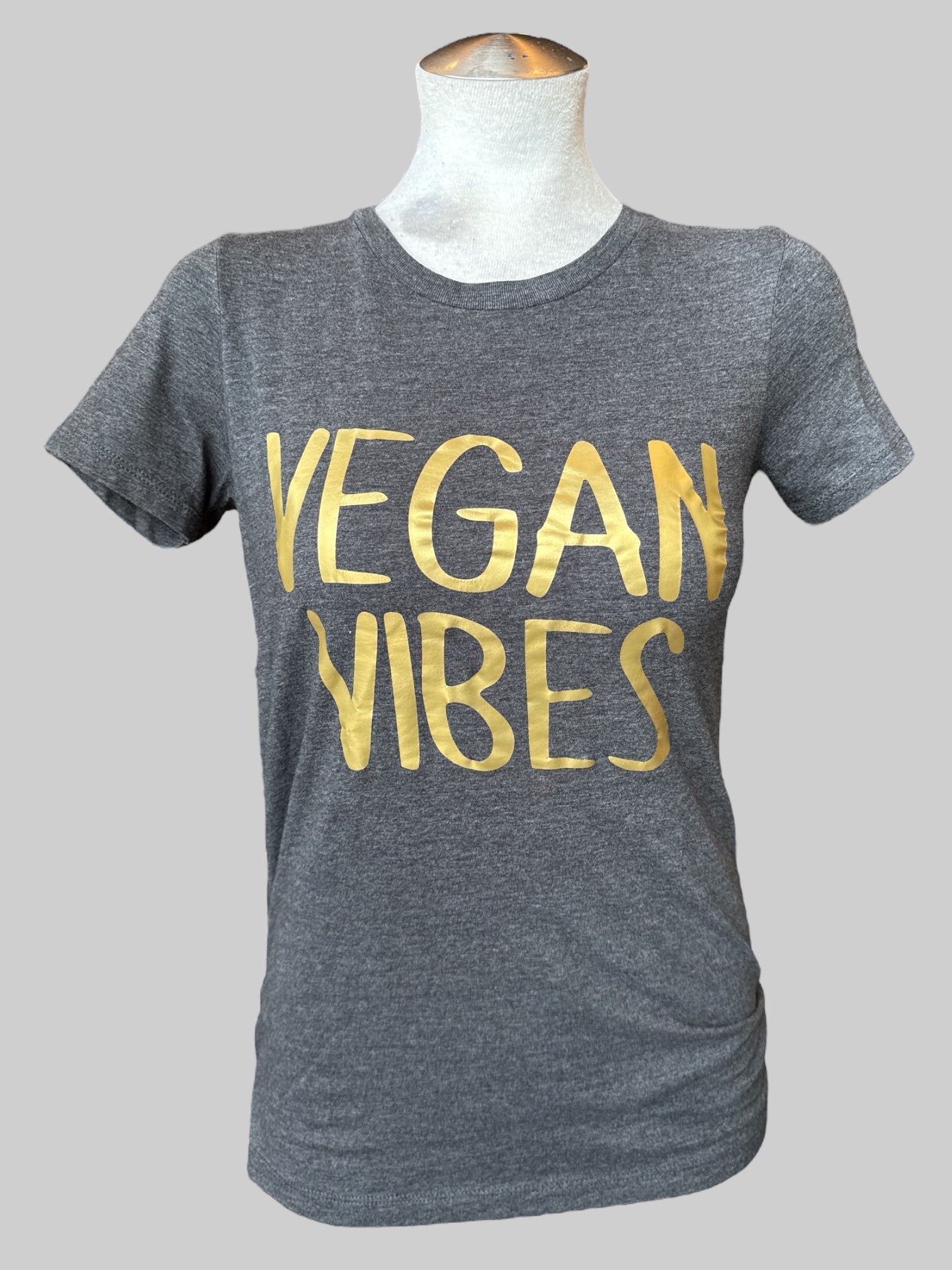 S Dark grey t shirt with “Vegan Vibes” gold lettering