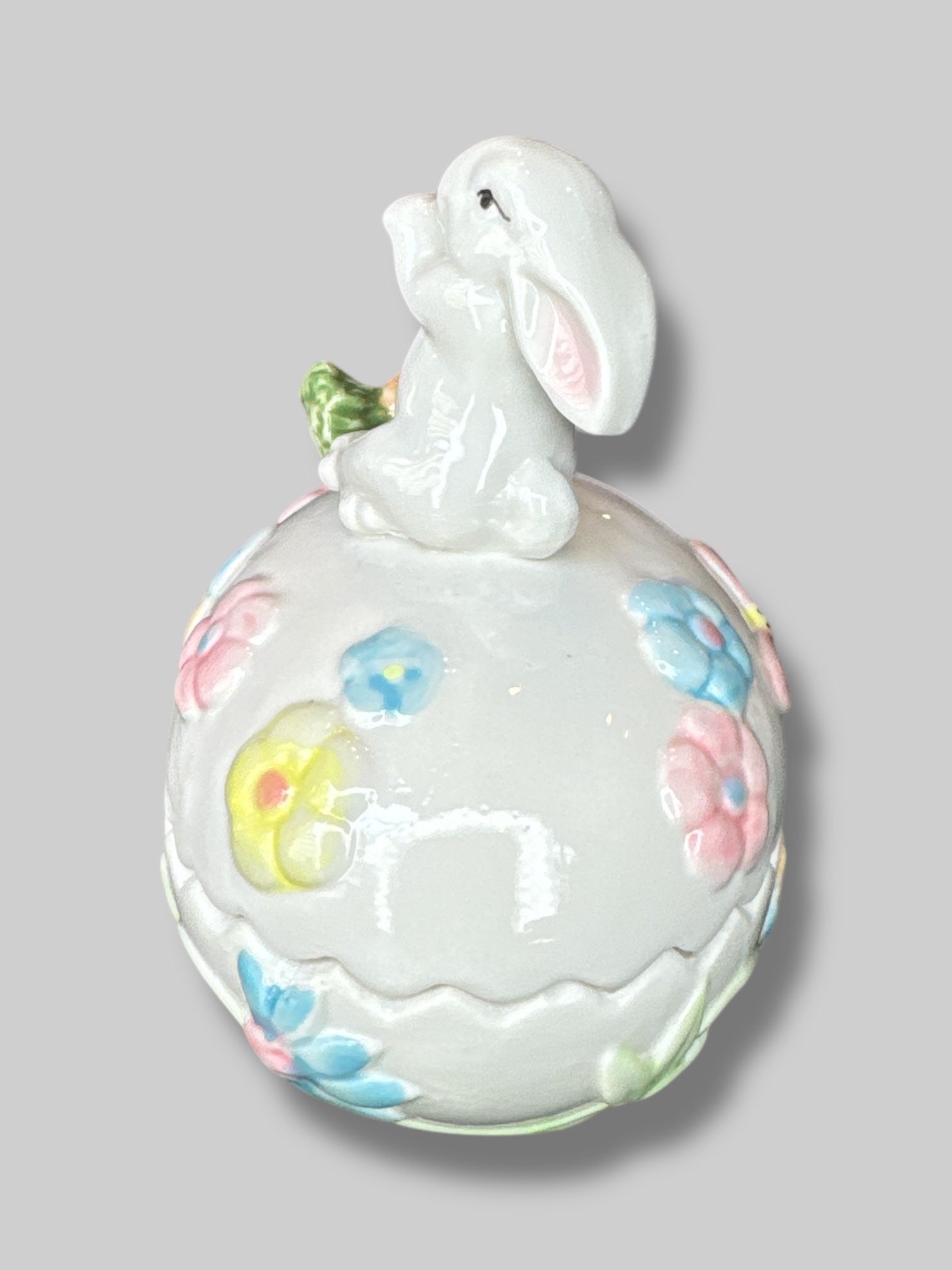 Vintage white egg shaped container with a bunny, florals, and a carrot