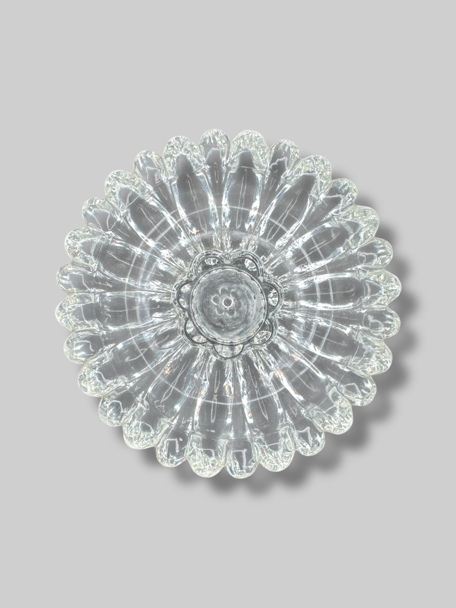 Glass flower shaped candle holder